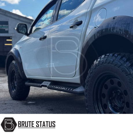 Mitsubishi L200 Series 5 2015-2019 Heavy Duty S32 Steel Side Steps in matt black, shown installed on a parked vehicle, highlighting durability and design.