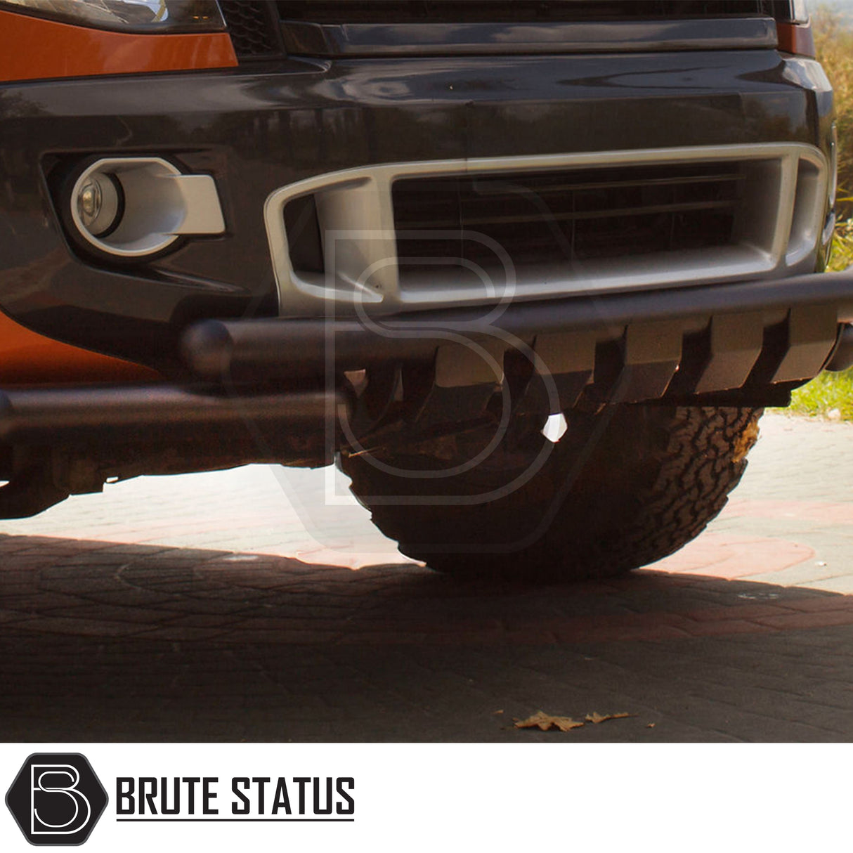 Nissan Navara NP300 2015-2022 City Bar (Nudge Bar) in matt black, shown on a orange Navara, enhances bumper protection and style.