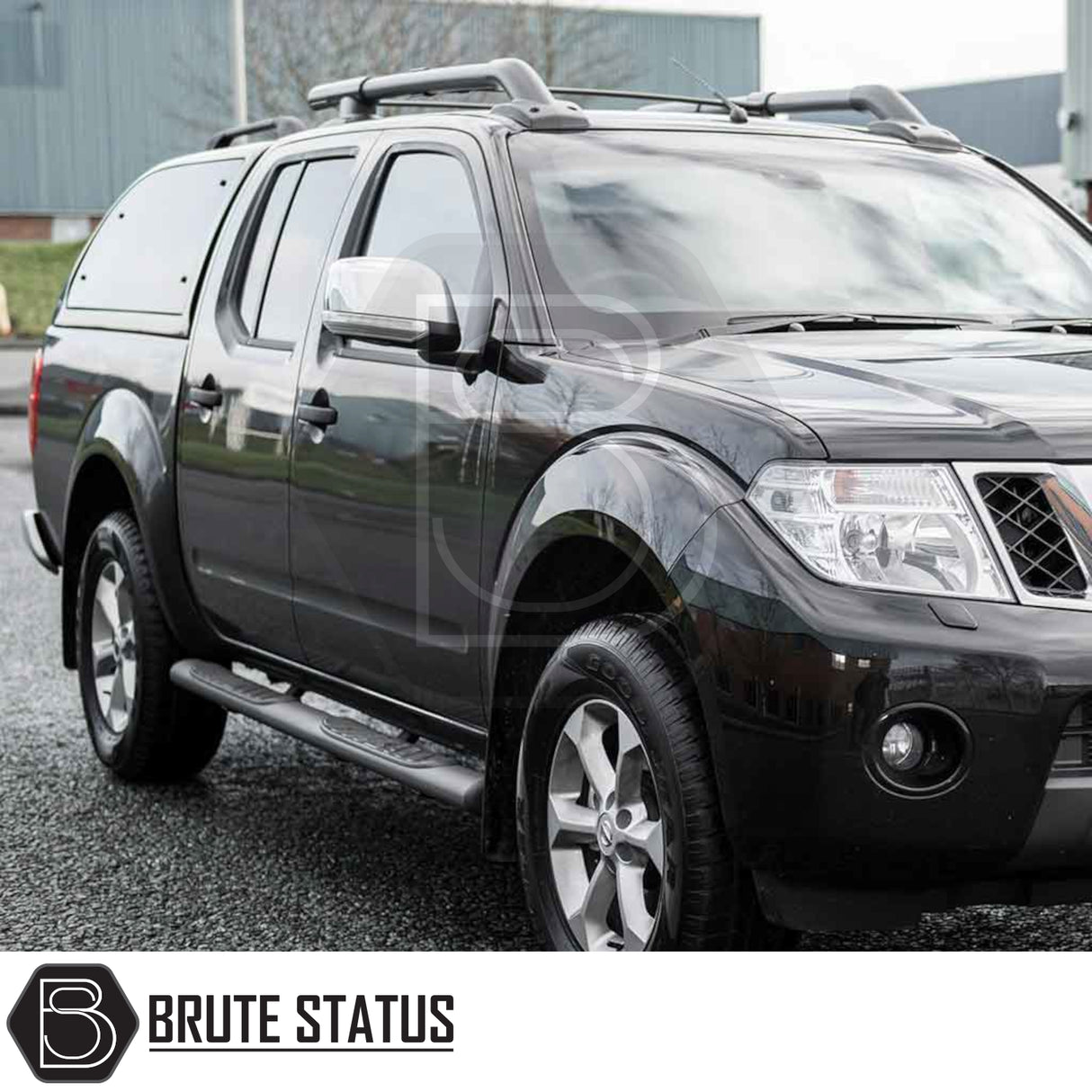 Nissan Navara 2005-2015 D40 Truckman Grand Hardtop Canopy with remote locking, featuring tinted windows, pop-out ventilation, and streamlined design, displayed on a crew-cab pickup truck.