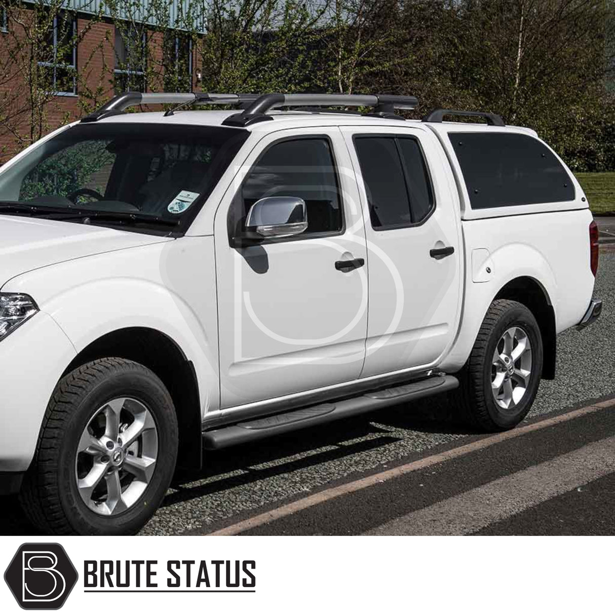 Nissan Navara 2005-2015 D40 Truckman Grand Hardtop Canopy with remote locking, featuring a white fiberglass canopy, black side-steps, and roof racks.