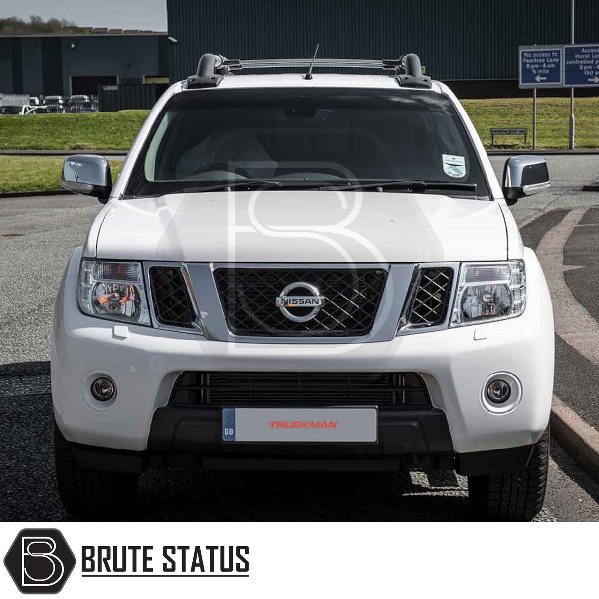 Nissan Navara 2005-2015 D40 with Truckman Grand Hardtop Canopy showcasing roof rack bars and branded accessories, enhancing storage and security for pick-up trucks.