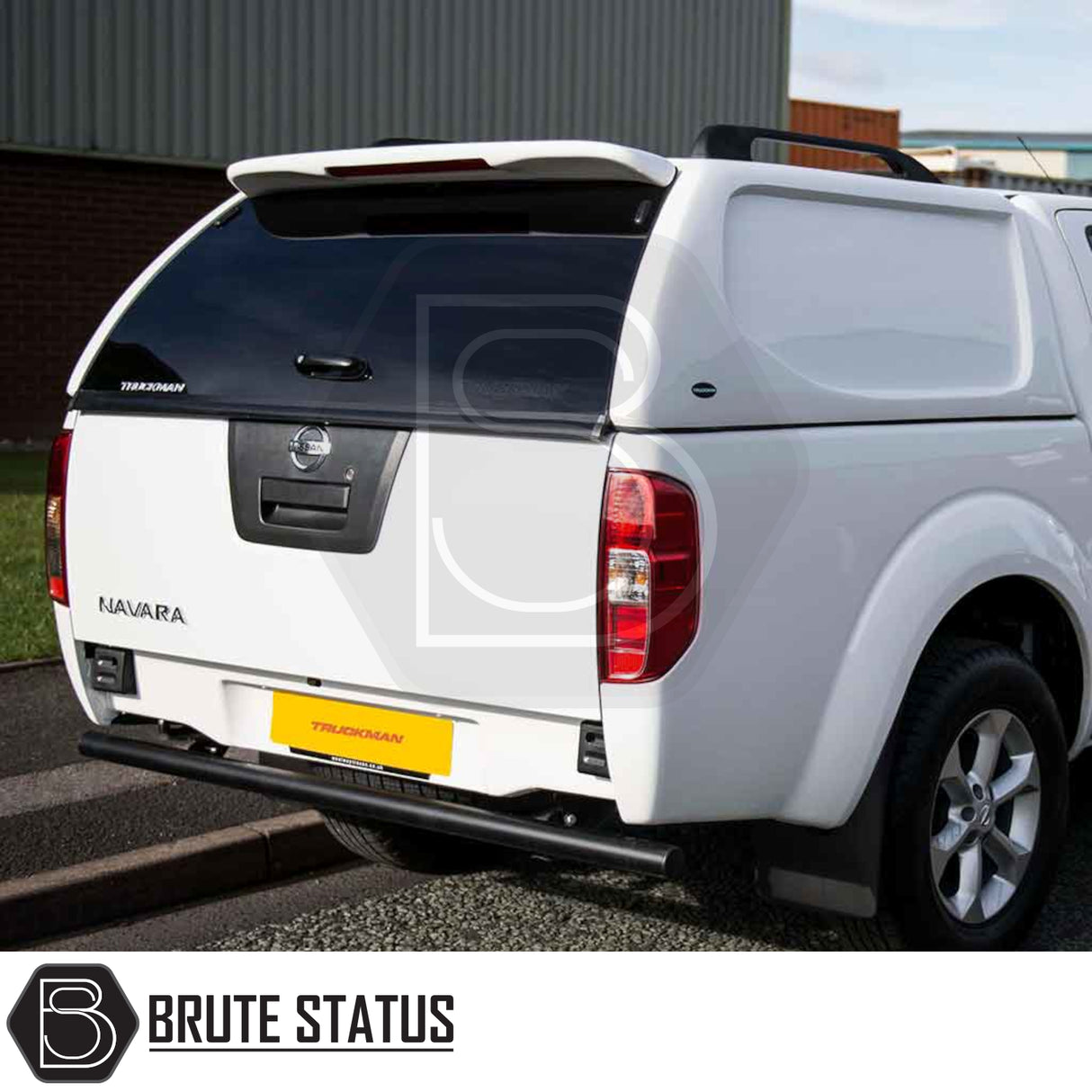 Rear view of a Nissan Navara with a Truckman L-Series Hardtop Canopy, featuring remote locking, tinted rear hatch, and solid sides for enhanced security.