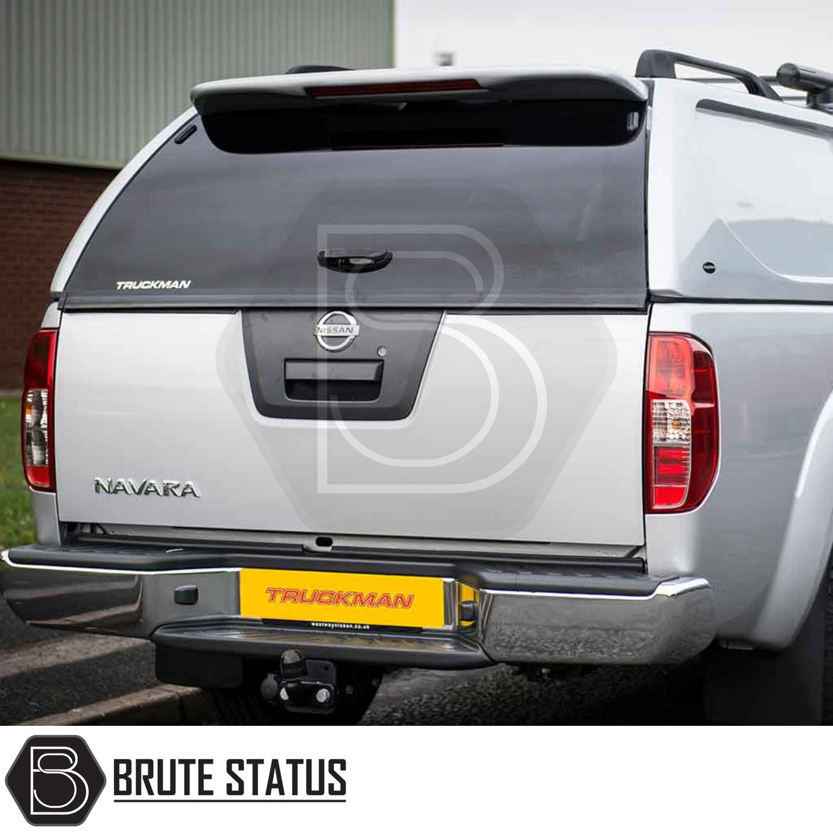 Nissan Navara 2005-2015 D40 Truckman L-Series Hardtop Canopy with solid sides, tinted glass, and remote locking, enhancing security and storage on a silver pickup.
