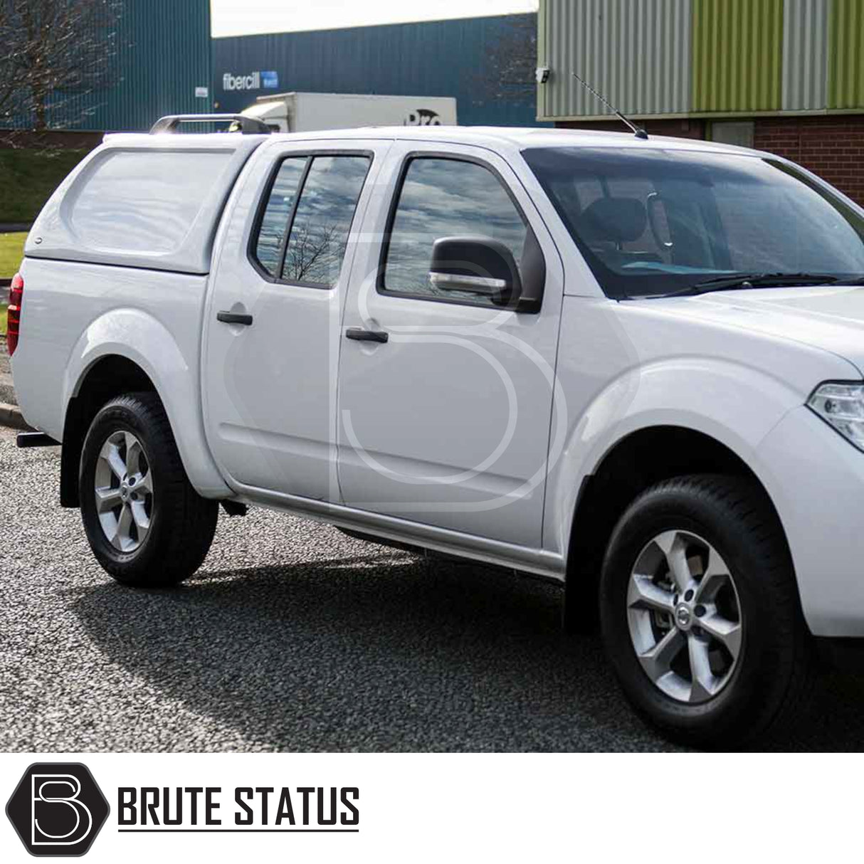 Nissan Navara 2005-2015 D40 Truckman L-Series Hardtop Canopy with remote locking, shown on a white double-cab pickup, enhances storage and security. Brute Status accessory.