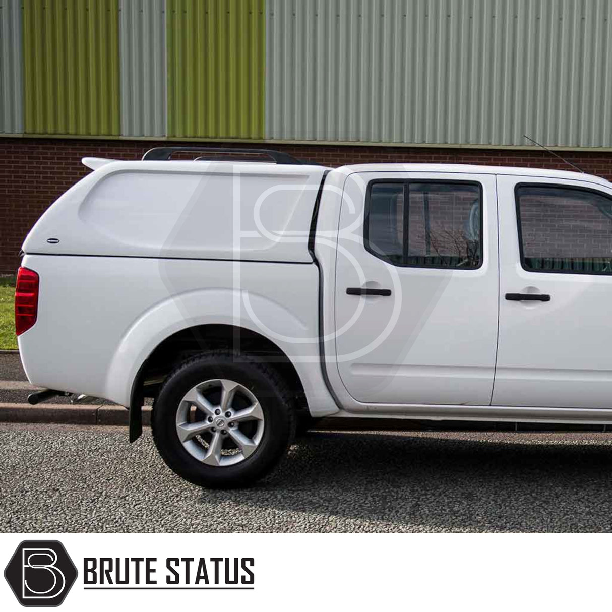 White Nissan Navara 2005-2015 with Truckman L-Series hardtop canopy by Brute Status, featuring remote locking and solid sides for enhanced security and style.