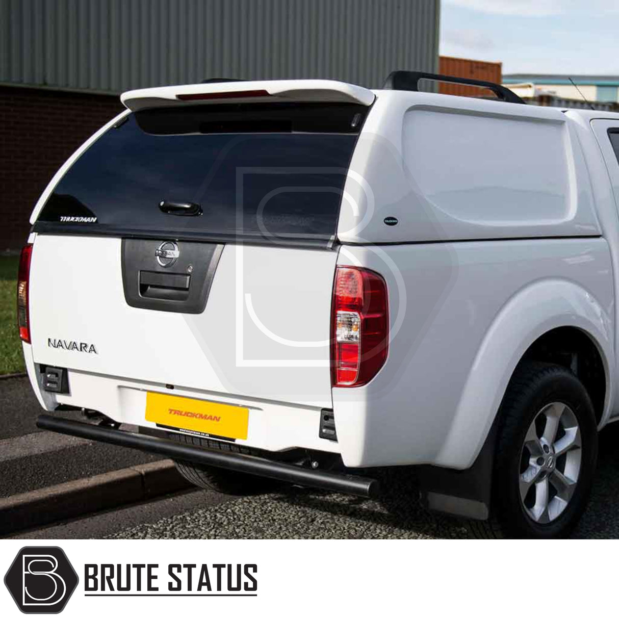 White Nissan Navara D40 with Truckman L-Series canopy, featuring remote locking, solid sides, and a tinted rear window for enhanced security and style.
