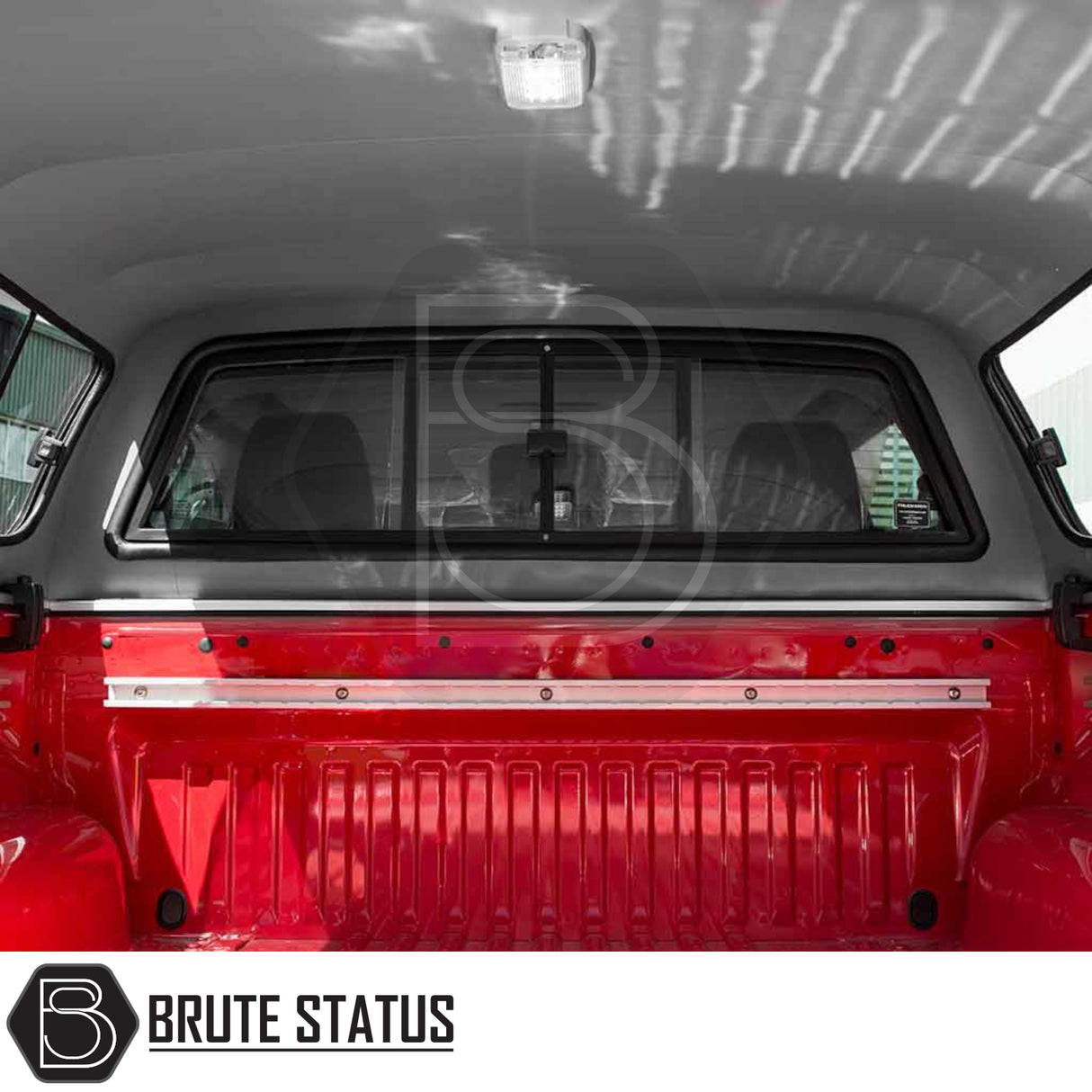 Nissan Navara 2015-2023 NP300 Truckman GLS Hardtop Canopy with remote locking showcased inside a pickup bed, featuring a dome light and branded BRUTE STATUS.