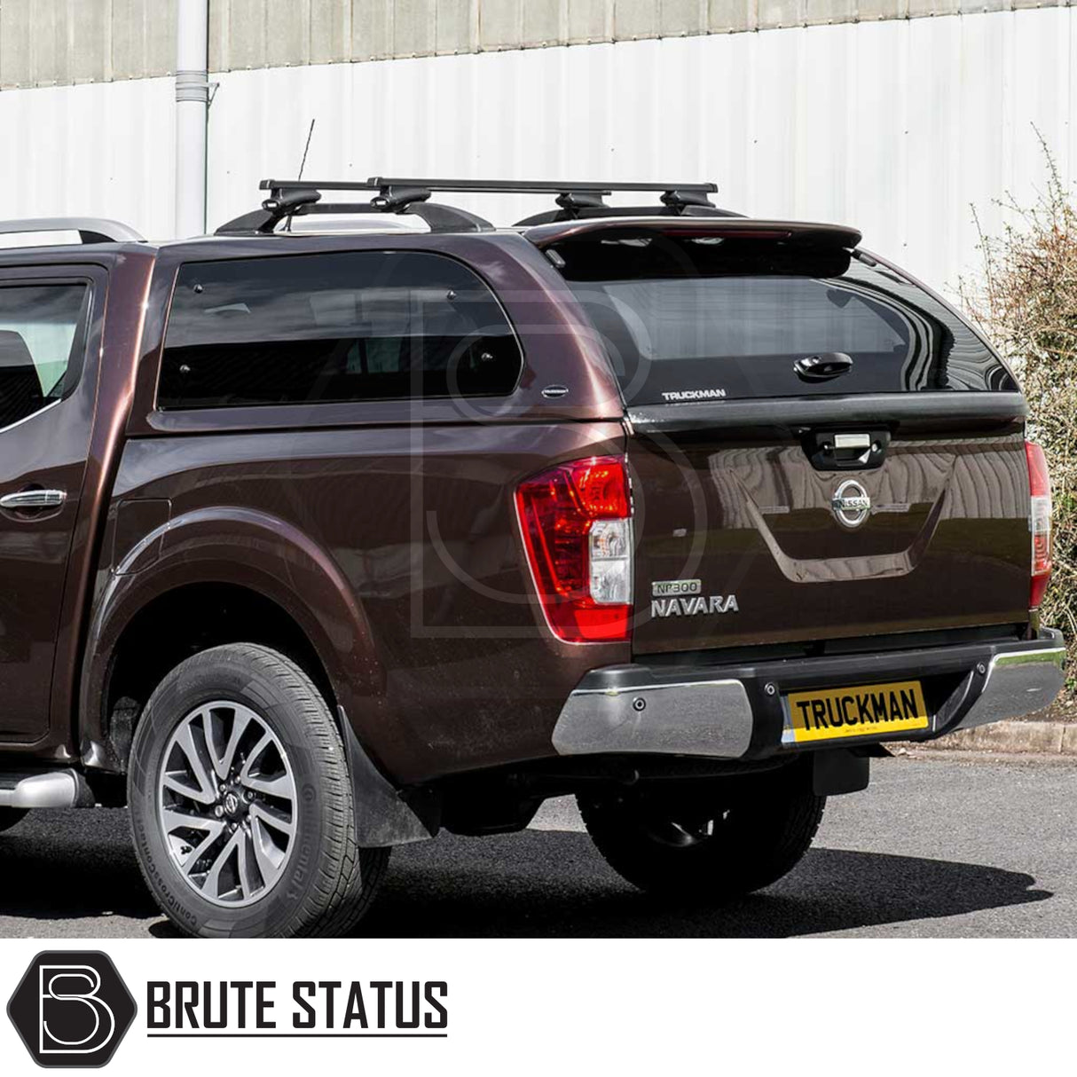 Nissan Navara 2015-2023 NP300 Truckman Grand Hardtop Canopy, showcasing rear view with black canopy and roof bars, highlighting enhanced storage and security features.