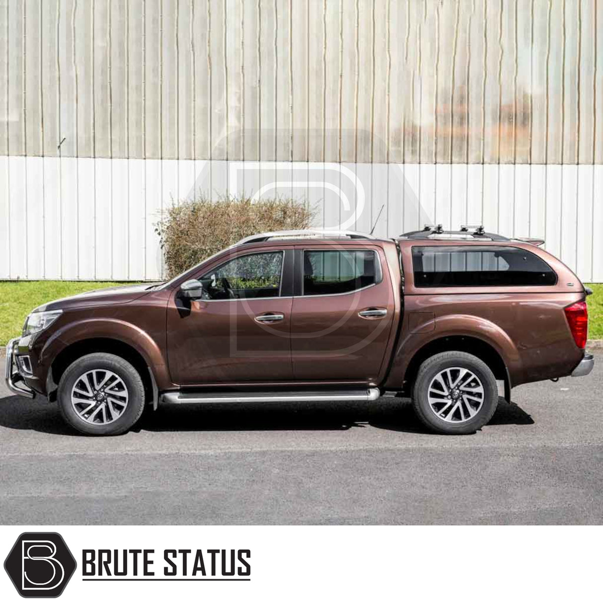Side view of a Nissan Navara 2015-2023 with a Truckman Grand Hardtop Canopy featuring remote locking and tinted windows, enhancing storage and security.