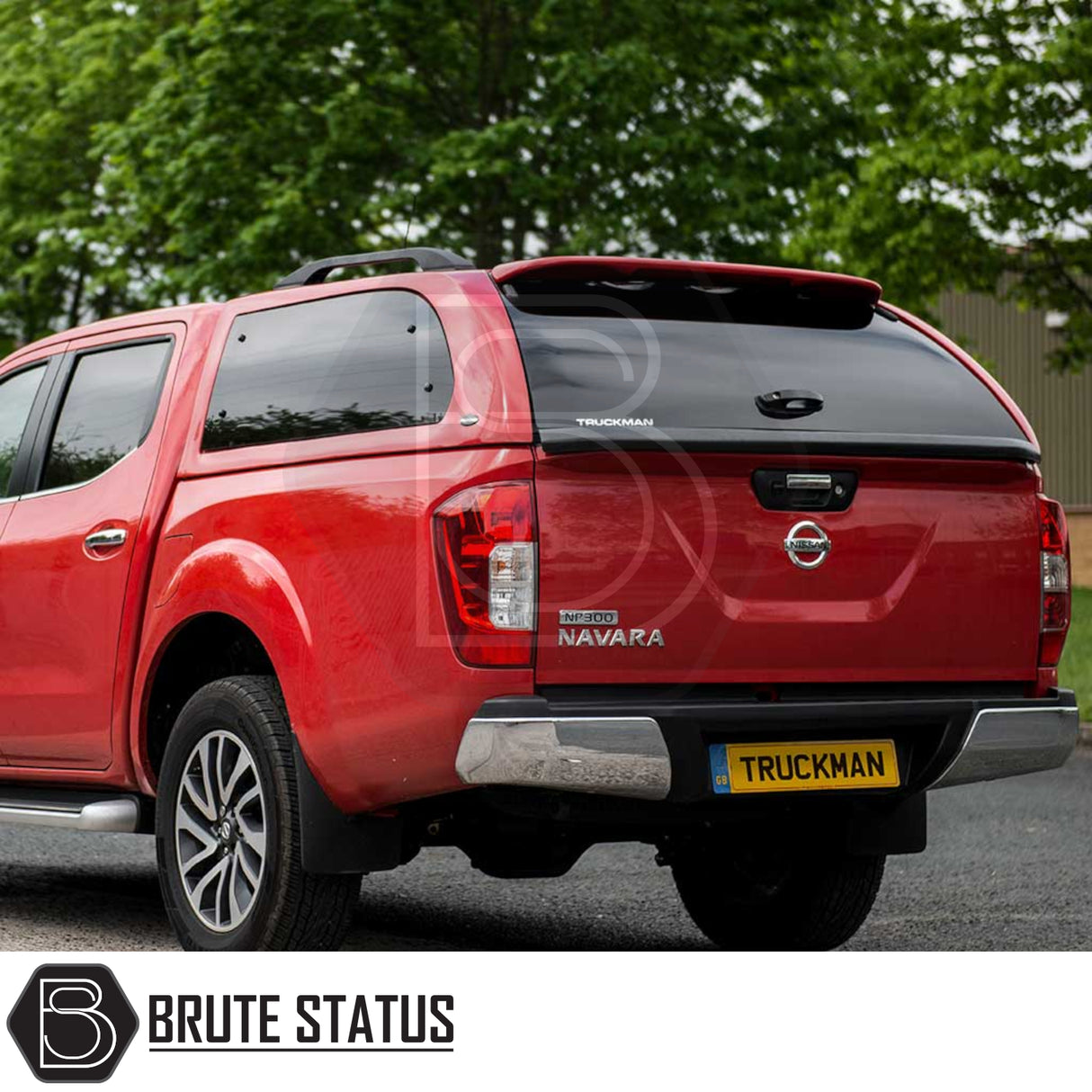 Rear view of a Nissan Navara 2015-2023 NP300 with a Truckman Grand Hardtop Canopy featuring tinted windows and remote locking, enhancing storage and security.