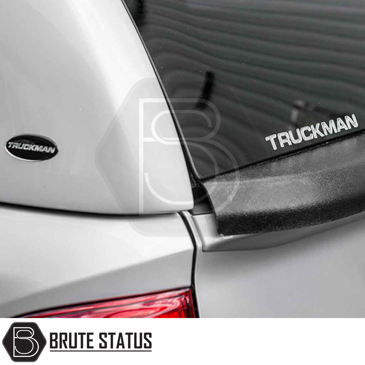 Close-up of Nissan Navara 2015-2023 NP300 Truckman Grand Hardtop Canopy showcasing tinted rear window, Truckman logos, part of the tail lamp, and Brute Status watermark.