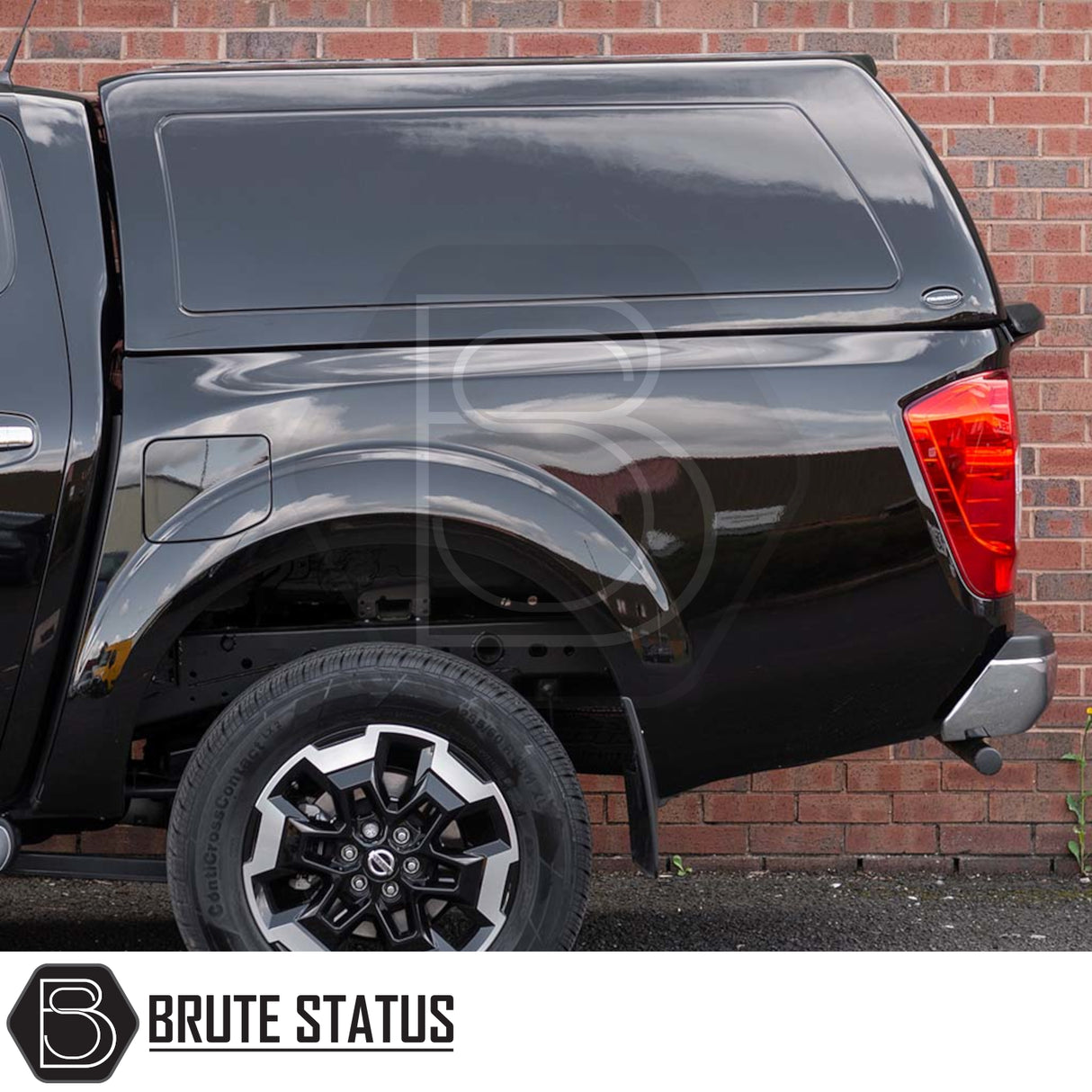 Nissan Navara 2015-2023 NP300 Truckman RS Hardtop Canopy with glazed rear window, remote locking, shown on a black pickup against a brick wall.