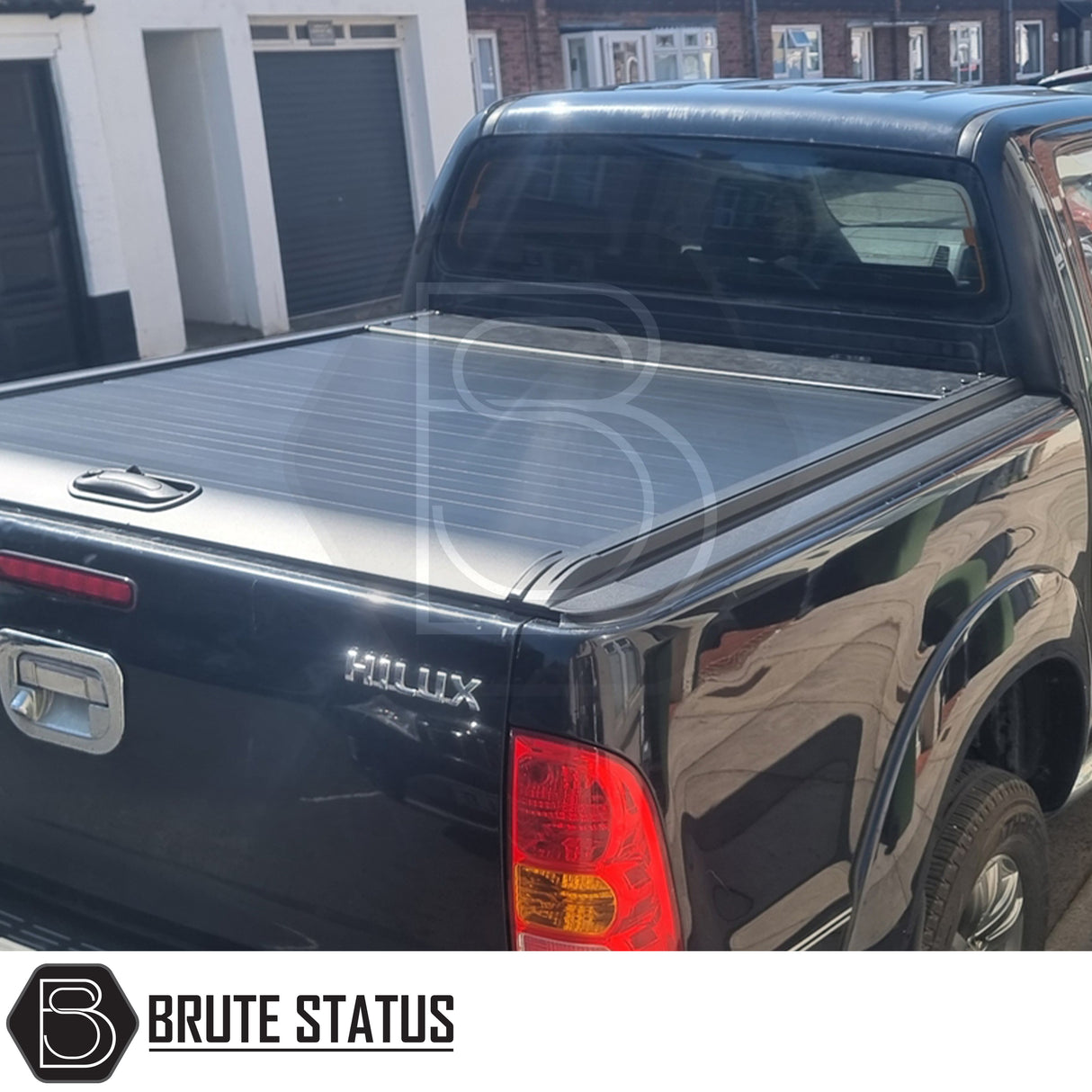 Black manual roller shutter for toyota hilux 2005-2014 pickup truck. Durable, high-quality design for secure cargo protection and easy manual operation