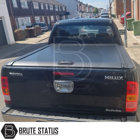 Black manual roller shutter for toyota hilux 2005-2014 pickup truck. Durable, high-quality design for secure cargo protection and easy manual operation