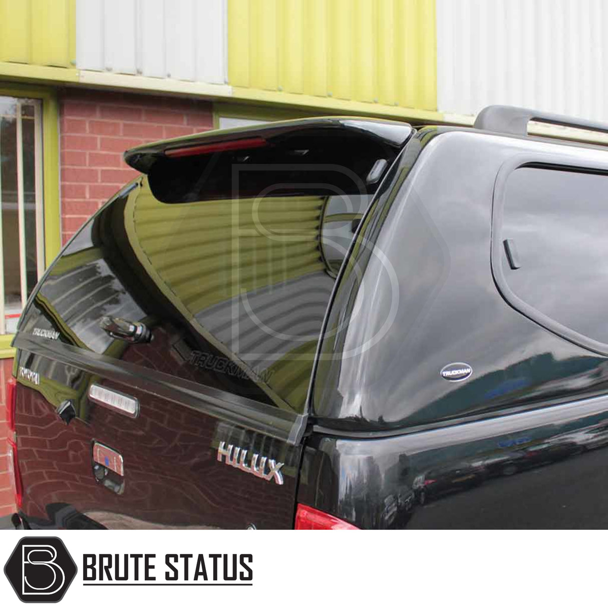 Toyota Hilux 2005-2016 MK6, MK7 Truckman GLS Hardtop Canopy with remote locking, featuring sliding windows and open rear hatch, enhancing truck's storage and security.