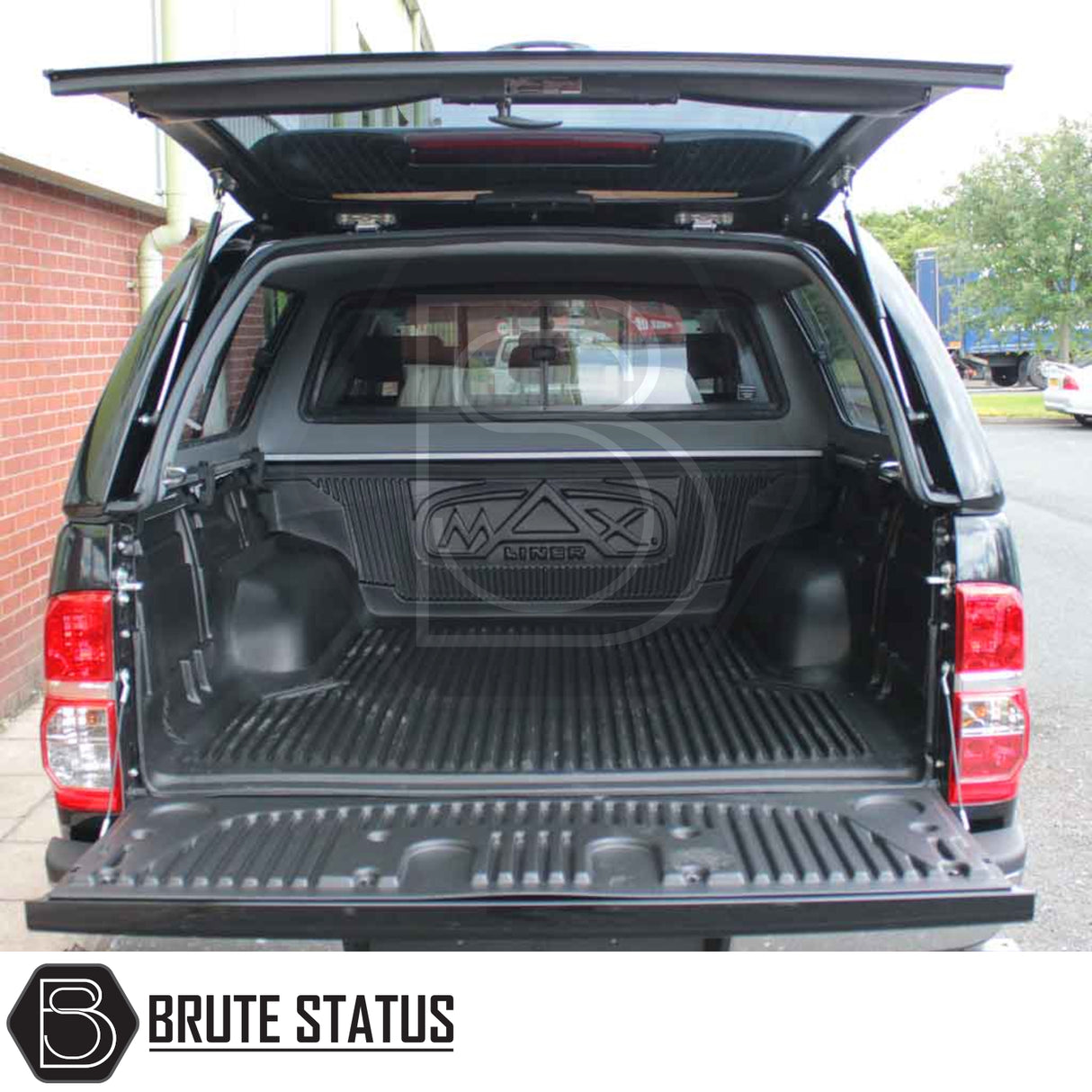 Toyota Hilux 2005-2016 Truckman GLS hardtop canopy with ribbed MAXliner bed liner, featuring remote locking and sliding windows for secure, ventilated cargo space.