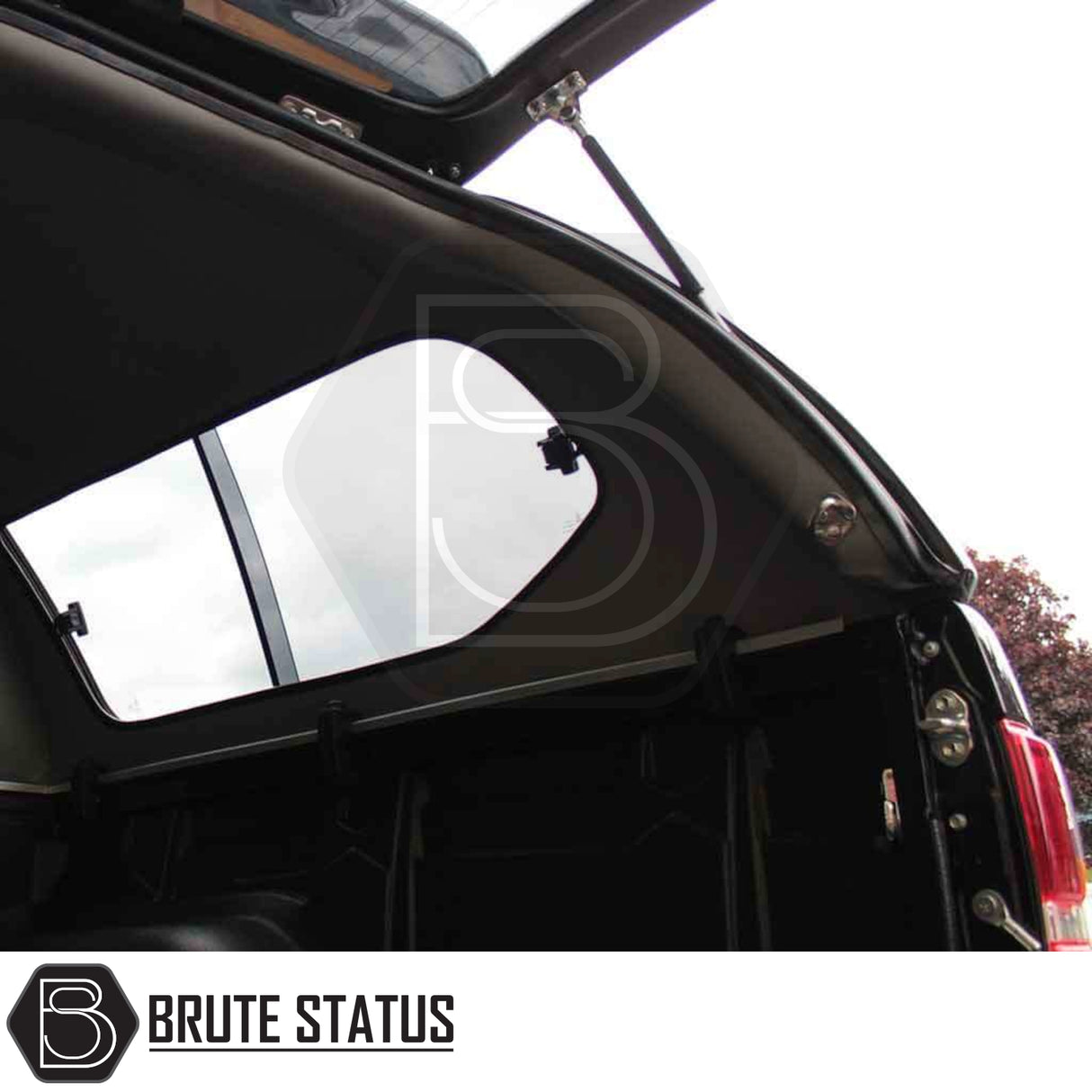 Pickup truck bed with open Truckman GLS canopy, featuring gas struts, tinted window, and tailgate, designed for Toyota Hilux 2005-2016 MK6, MK7.