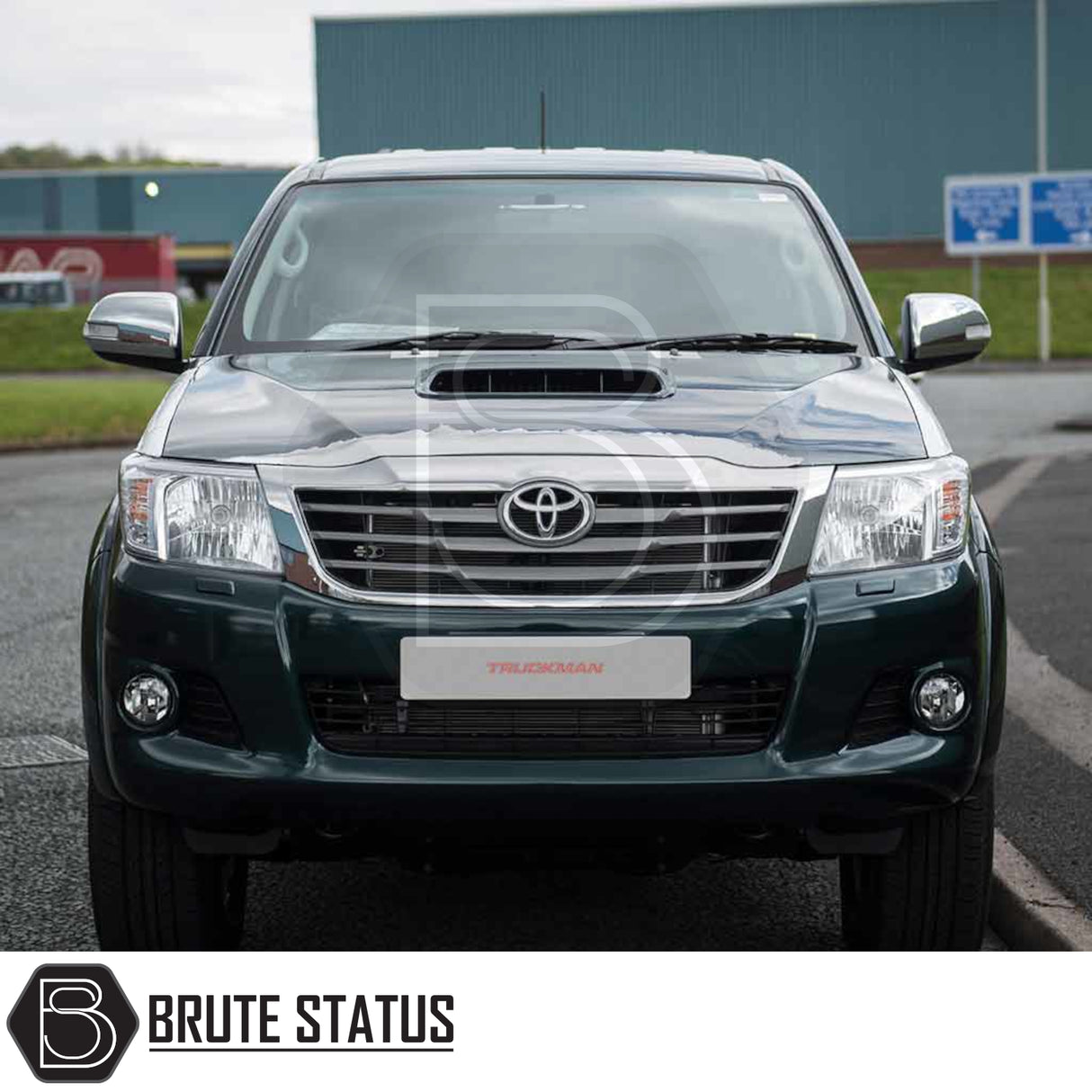 Toyota Hilux with Truckman GLS hardtop canopy, showcasing its chrome grille and BRUTE STATUS badge. Features remote locking, tinted windows, and stylish spoiler.