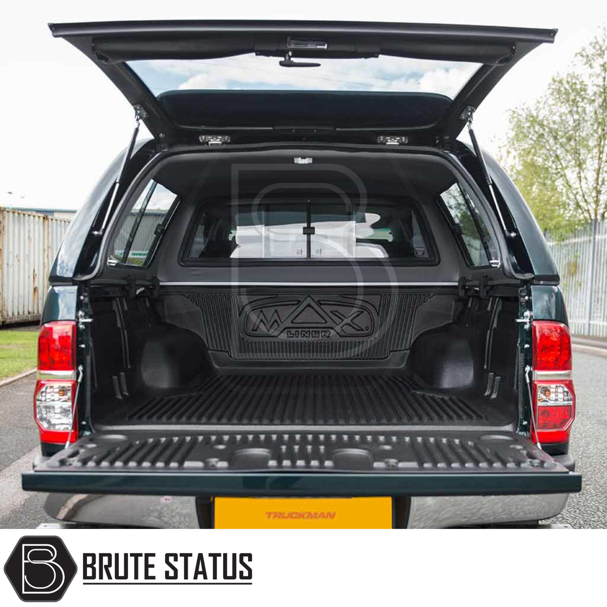 Toyota Hilux 2005-2016 Truckman GLS canopy with open tailgate, showcasing ribbed bedliner and lifted window. Ideal for secure, ventilated storage and pet transport.