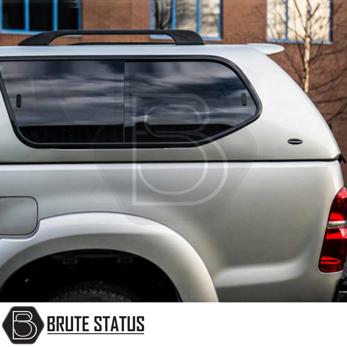 Toyota Hilux 2005-2016 MK6, MK7 Truckman GLS hardtop canopy with tinted windows, roof-rack rails, and Brute Status branding, offering secure remote locking and stylish functionality.