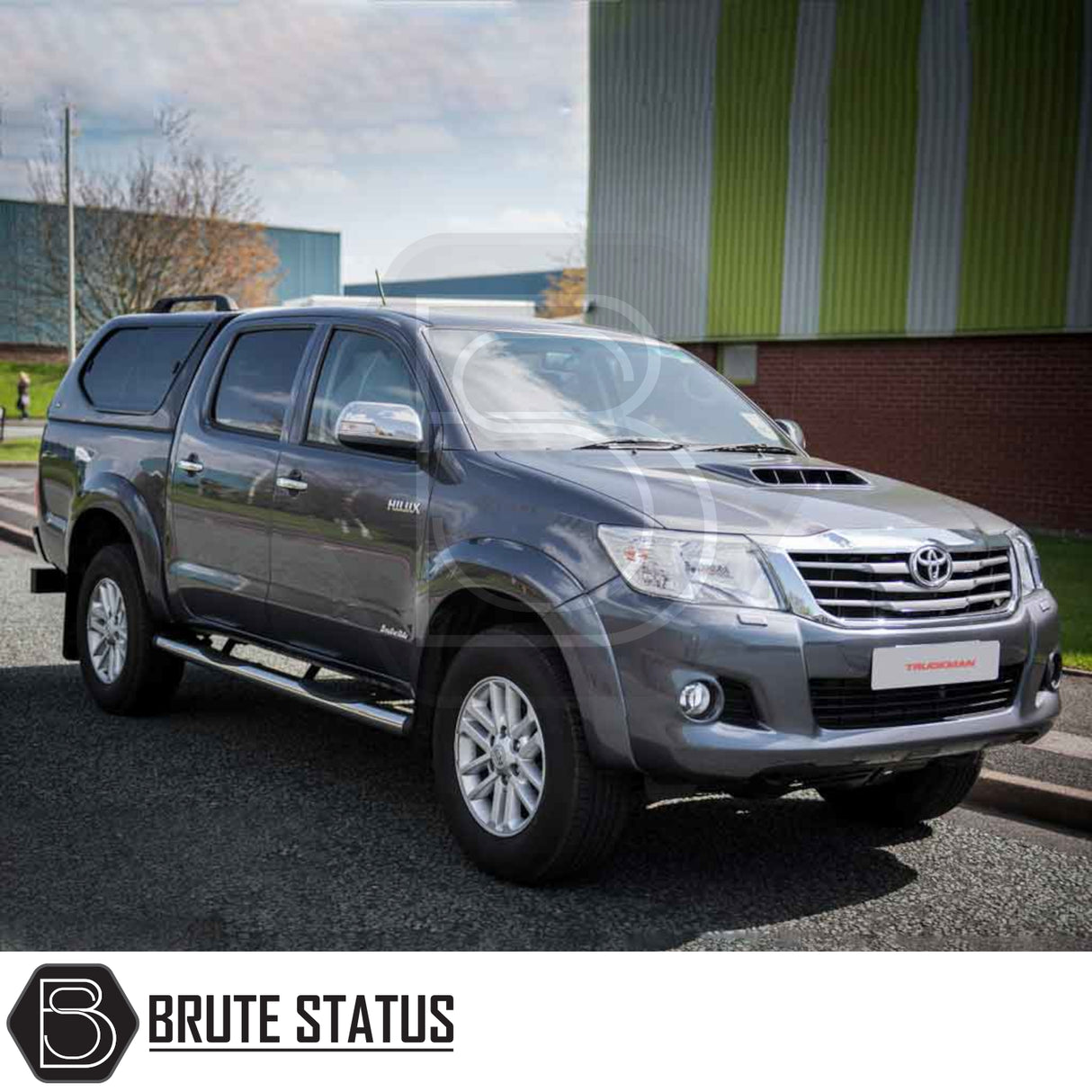 Toyota Hilux 2005-2016 MK6, MK7 Truckman GLS Hardtop Canopy with remote locking, fitted on a silver-grey double-cab pickup truck parked in front of an industrial building.