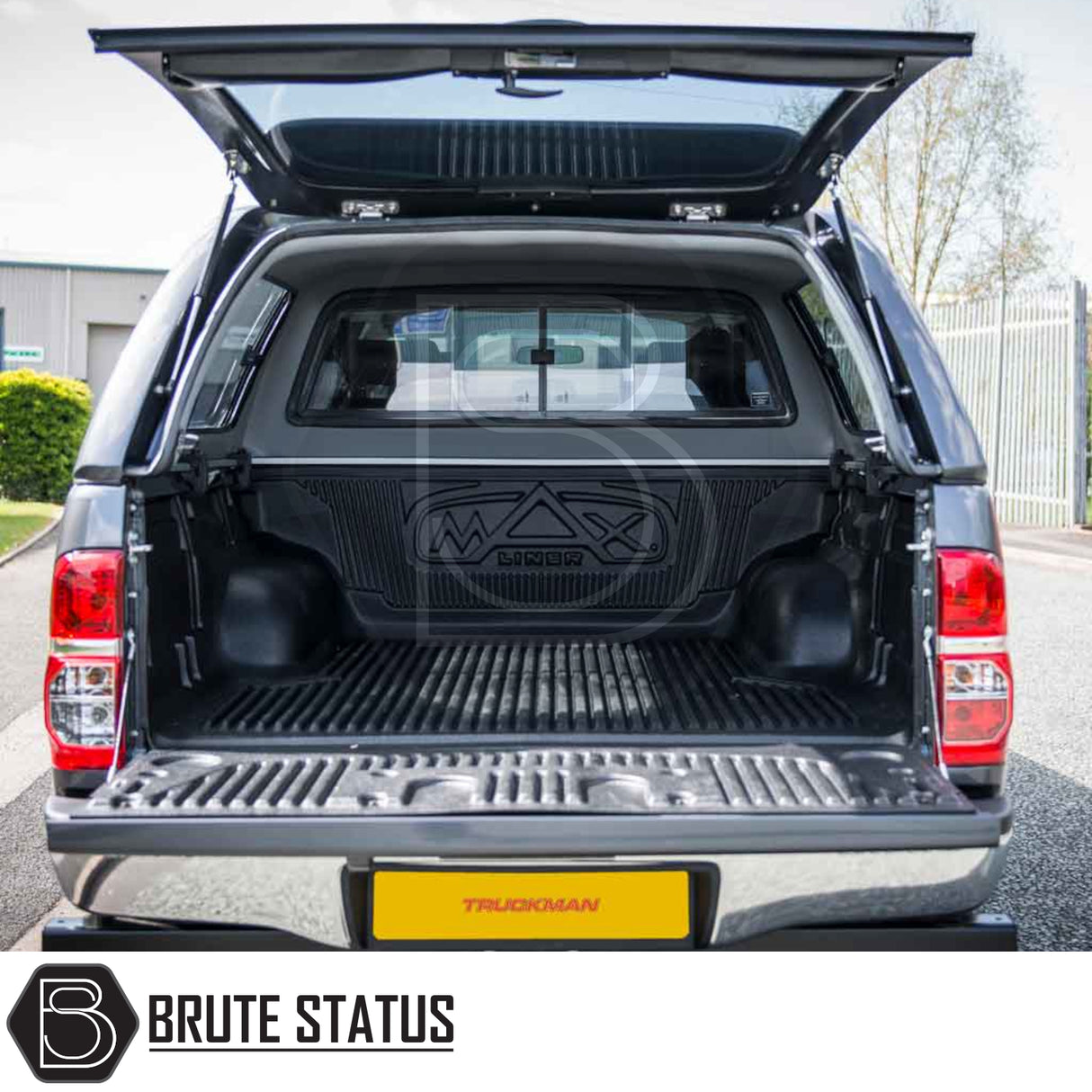 Toyota Hilux 2005-2016 MK6, MK7 Truckman GLS Hardtop Canopy with open tailgate and MAX LINER bedliner, showcasing lockable sliding windows and integrated remote locking.