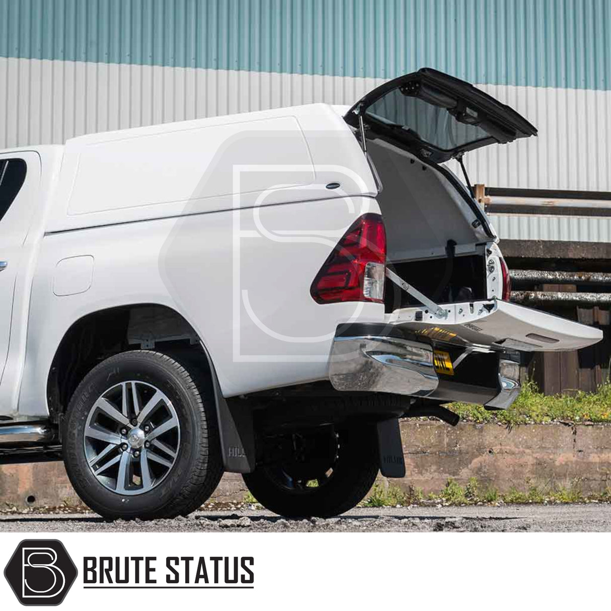 Toyota Hilux 2016+ MK8, MK9 Truckman RS Hardtop Canopy with solid rear window, shown open on a white pickup truck, highlighting secure, durable design for commercial use.