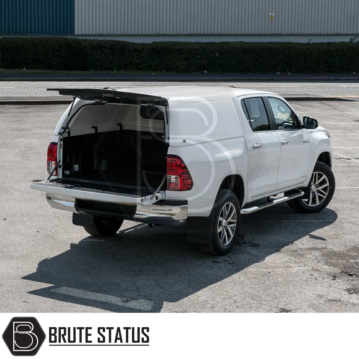 Toyota Hilux 2016+ MK8, MK9 Truckman RS Hardtop Canopy with solid rear window, fitted on a white pickup, tailgate and canopy hatch open, showcasing secure storage.