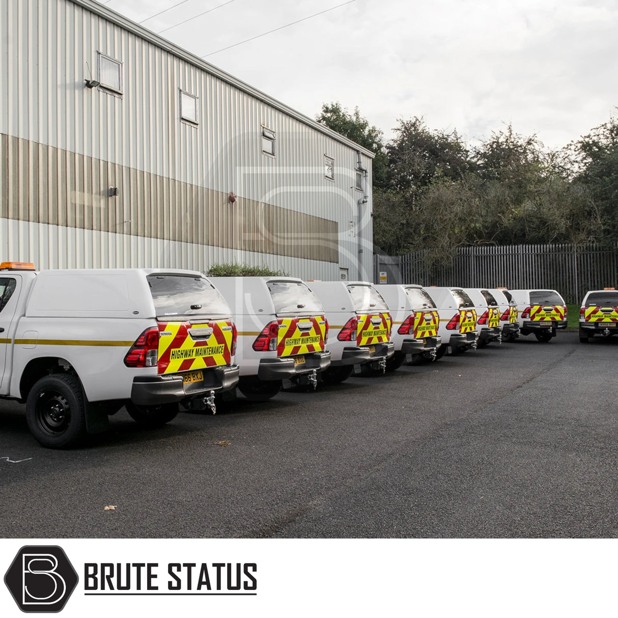 Toyota Hilux 2016+ MK8, MK9 Truckman RS Hardtop Canopy, solid rear window, fitted on white service vehicles with HIGHWAY MAINTENANCE chevron markings, parked in industrial lot.