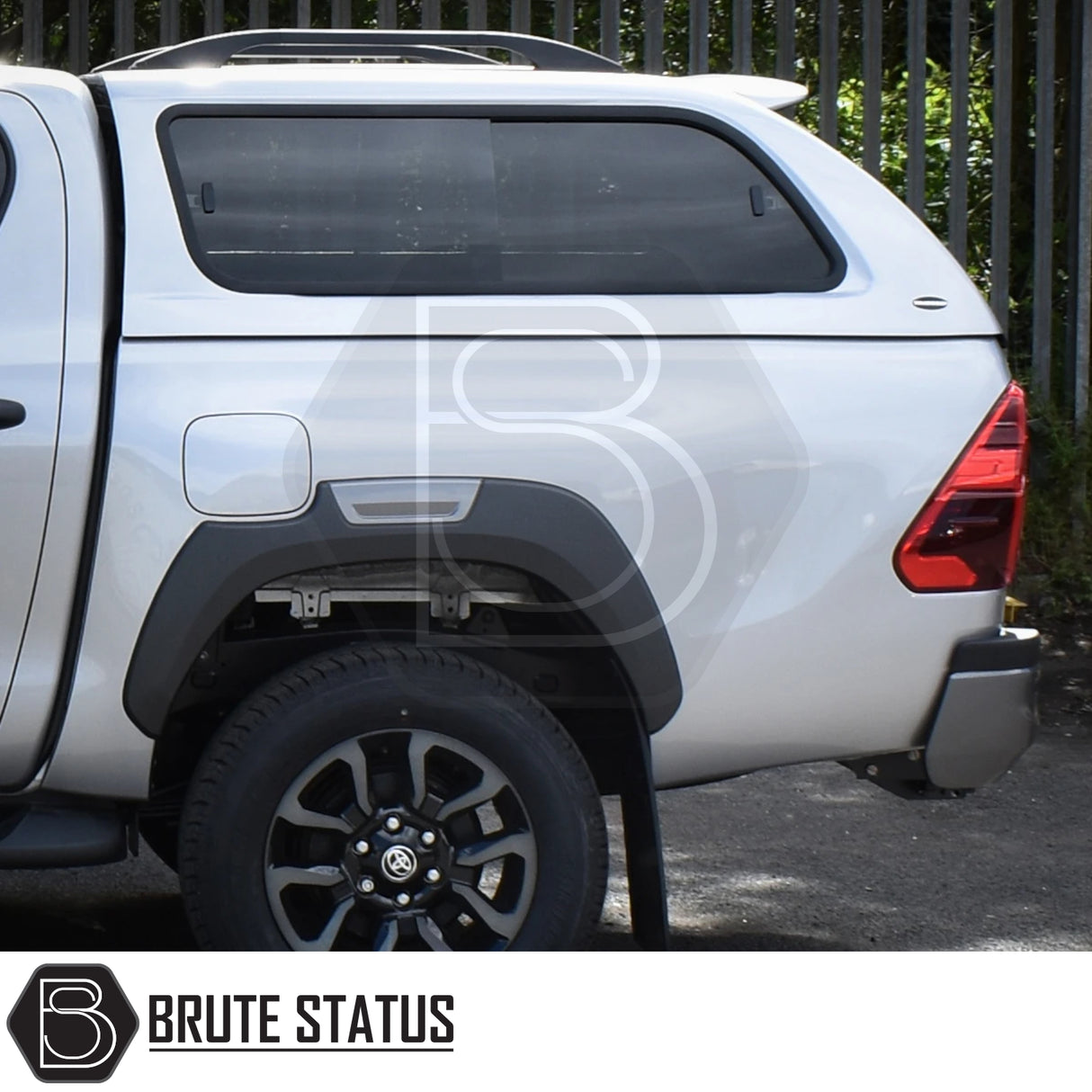 Toyota Hilux Invincible X 2016+ MK8, MK9 Truckman GLS Hardtop Canopy with remote locking, showcasing side window, black fender flare, and alloy wheel.