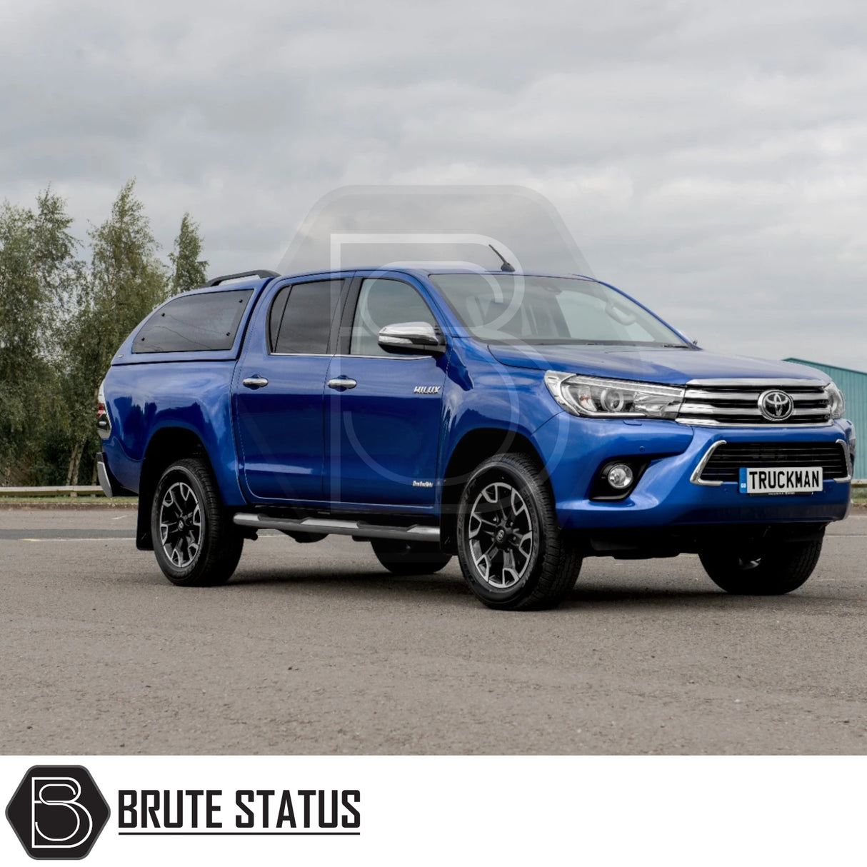 Toyota Hilux Invincible X with Truckman Grand Hardtop Canopy, featuring remote locking, tinted windows, and pop-out ventilation, enhancing storage and security.