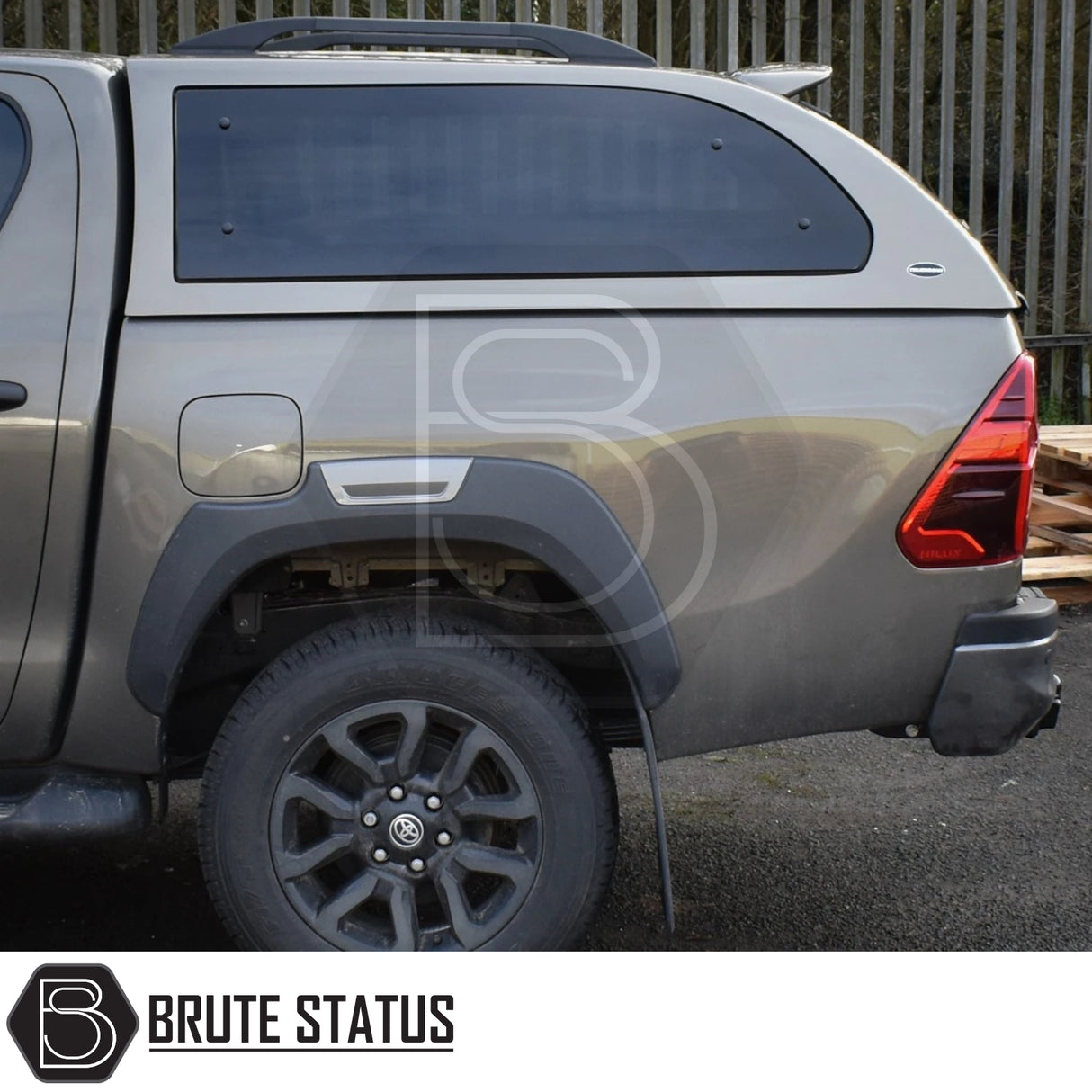 Toyota Hilux Invincible X with Truckman Grand Hardtop Canopy; features tinted windows, roof rails, remote locking, enhancing utility and style.