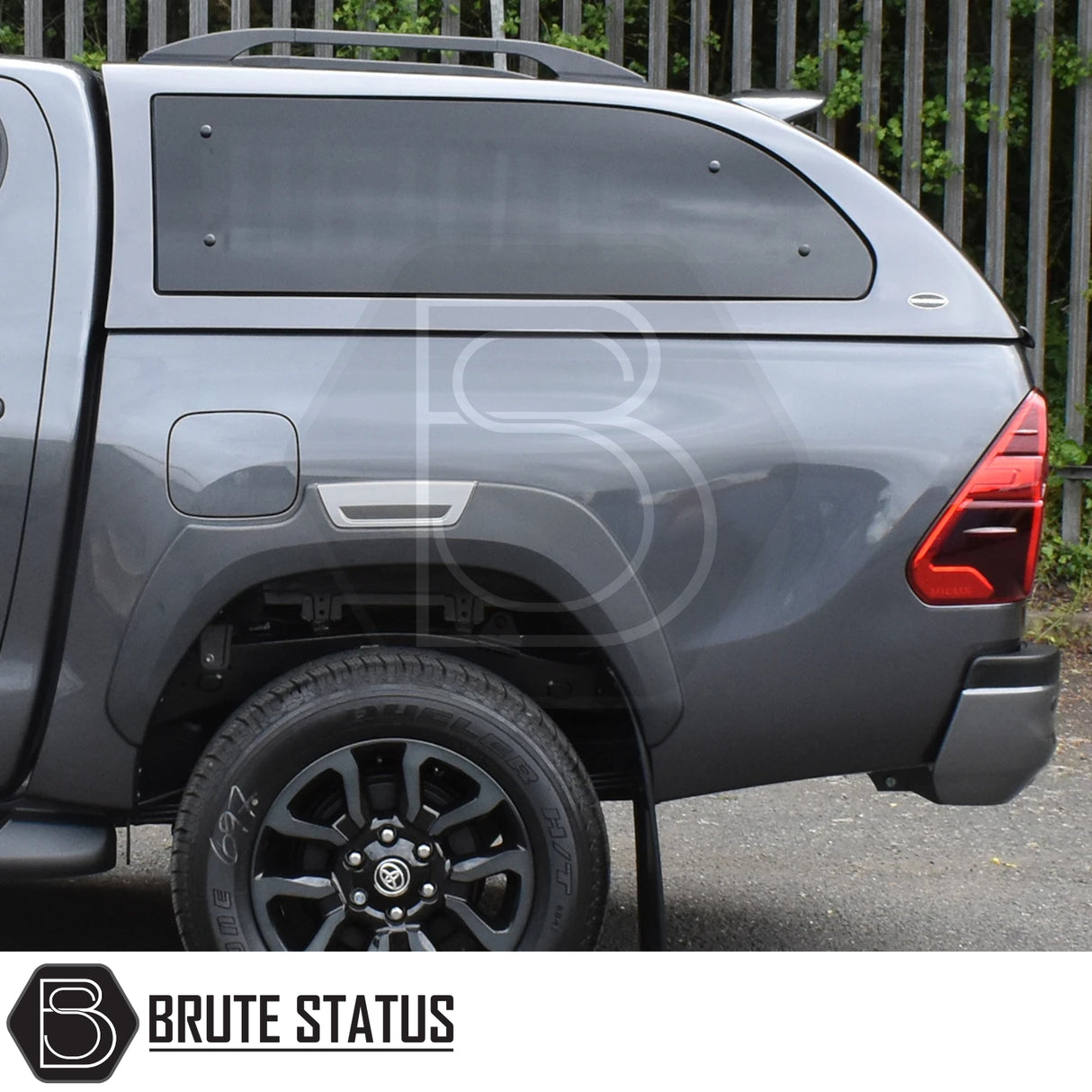 Toyota Hilux Invincible X 2016+ Truckman Grand hardtop canopy with tinted windows, pop-out features, and remote locking, installed by Brute Status.