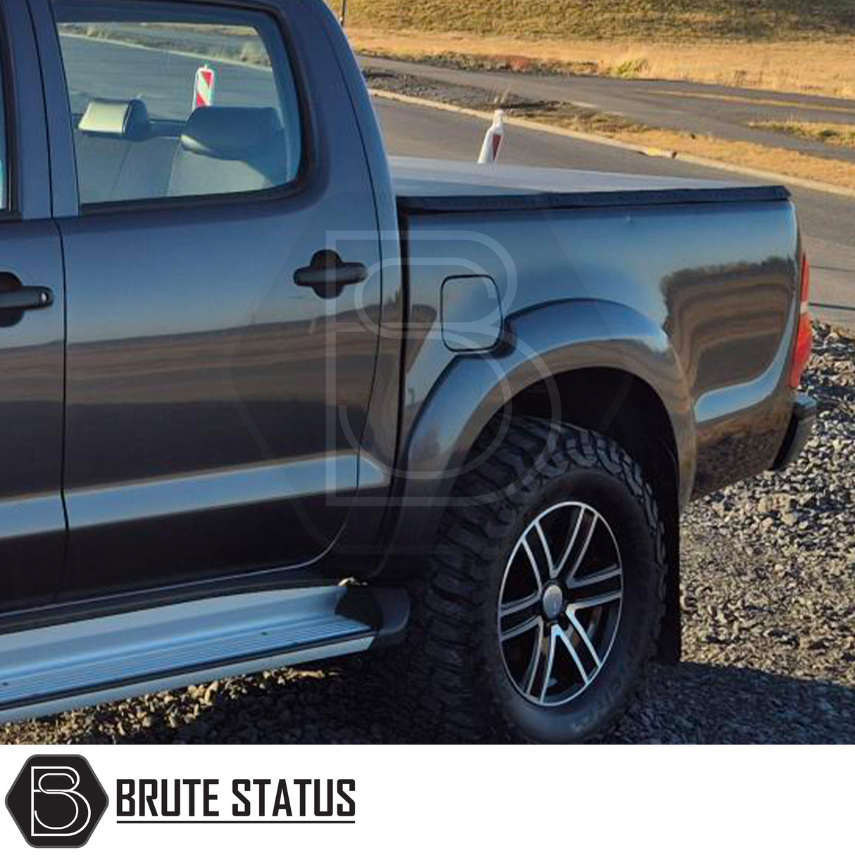 Toyota Hilux 2005-2014 Tonneau Cover, tri-fold design, enhances aerodynamics, UV-stable vinyl, aluminium securing catch, easy install, no drilling required.