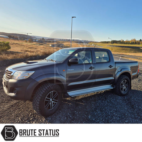 Toyota Hilux 2005-2014 Tonneau Cover, tri-fold design, enhances aerodynamics, UV-stable vinyl, aluminium securing catch, easy install, no drilling required.