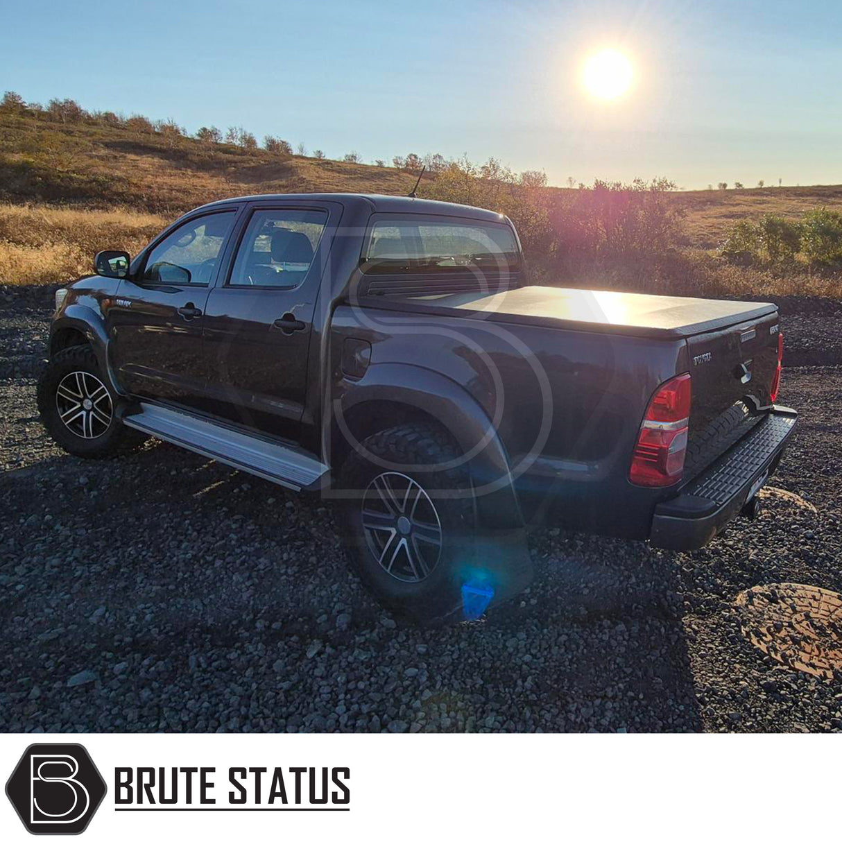 Toyota Hilux 2005-2014 Tonneau Cover, tri-fold design, enhances aerodynamics, UV-stable vinyl, aluminium securing catch, easy install, no drilling required.