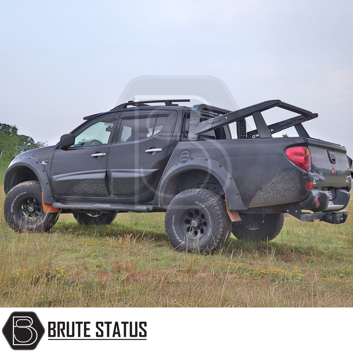 S70 matte black pickup truck roll bar with adjustable height and width for overlanding roof tents and outdoor adventure equipment fitted onto black L200 pickup truck offroad 4x4.