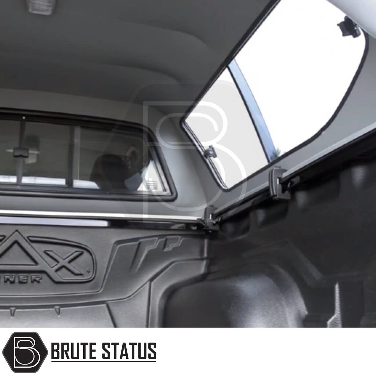Volkswagen Amarok 2010-2022 Truckman GLS Hardtop Canopy interior, showcasing molded bed-liner, open side-panel window, and BRUTE STATUS branding.