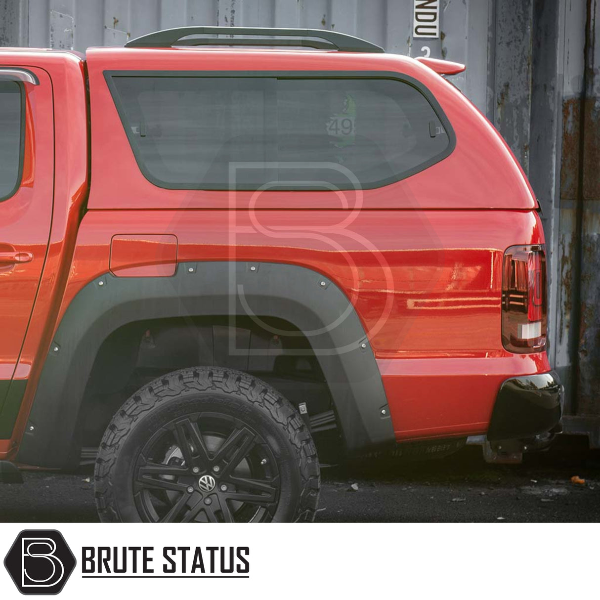 Volkswagen Amarok 2010-2022 Truckman GLS Hardtop Canopy with lockable sliding windows, black fender flares, and off-road wheels, enhancing pickup functionality and style.