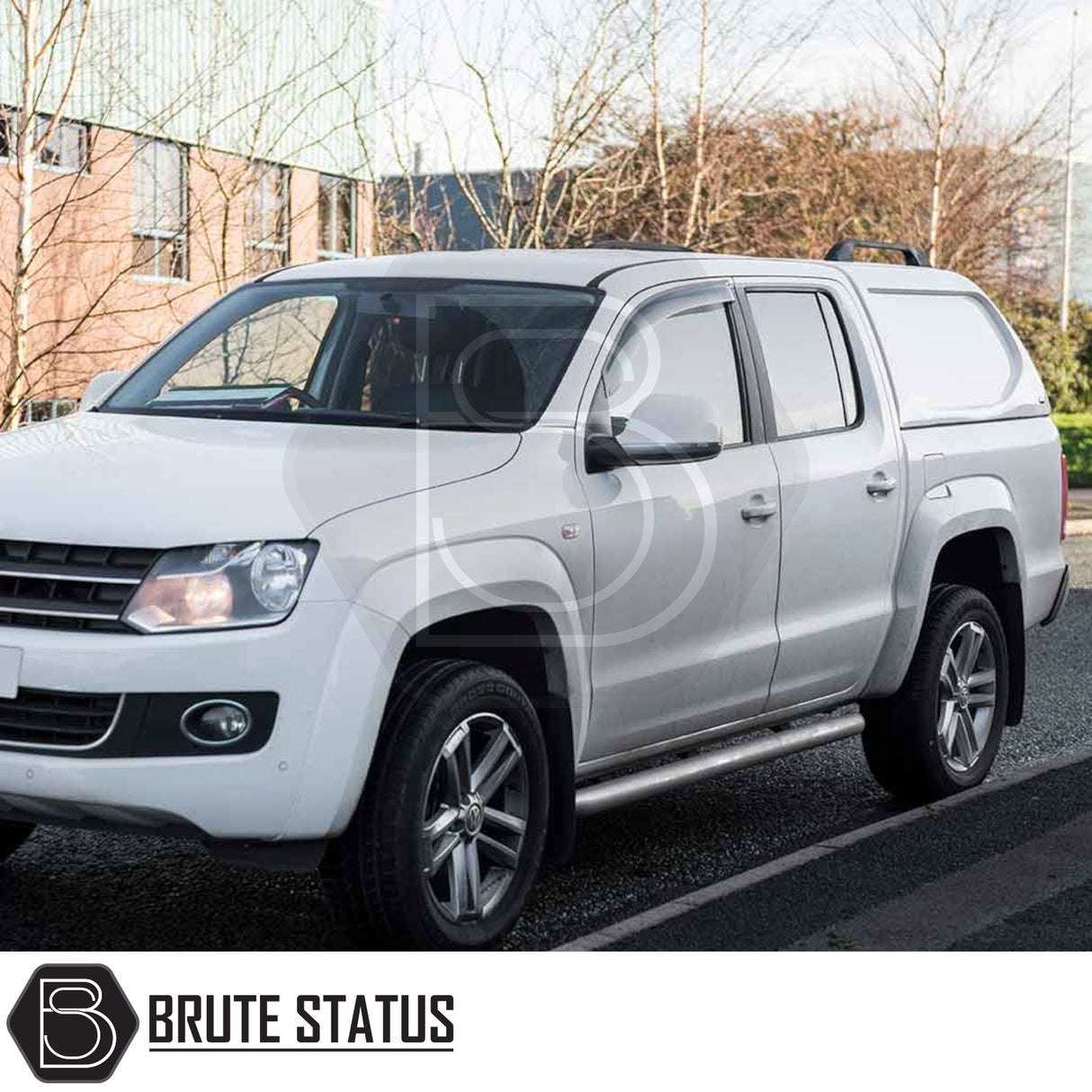 Volkswagen Amarok 2010-2022 Truckman L-Series hardtop canopy on a white pickup, featuring a seamless cab-high design and solid sides for enhanced security. Brute Status logo visible.