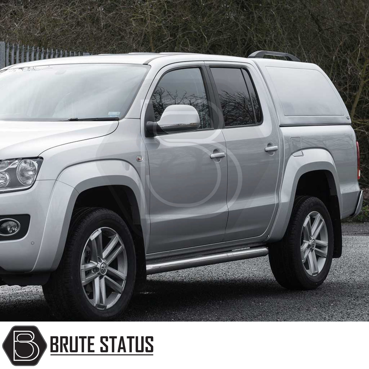 Volkswagen Amarok with Truckman RS Hardtop Canopy, featuring a solid rear window and remote locking, showcasing tubular side-steps and alloy wheels.