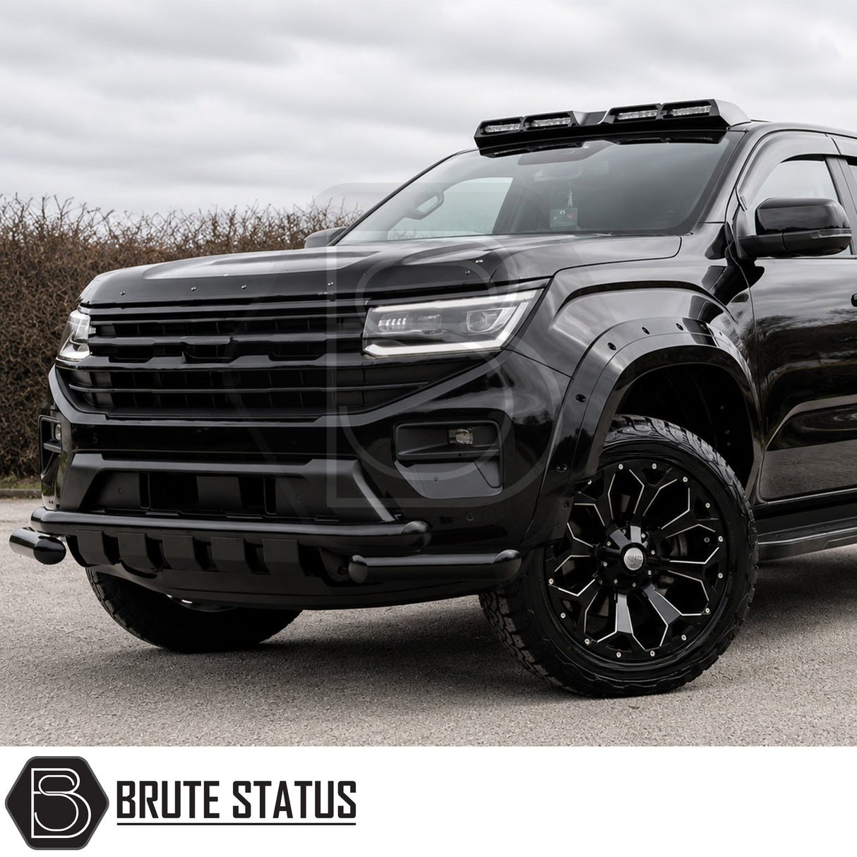 Modified Volkswagen Amarok pickup truck with matte black city bar installed for enhanced front bumper protection and bold exterior styling