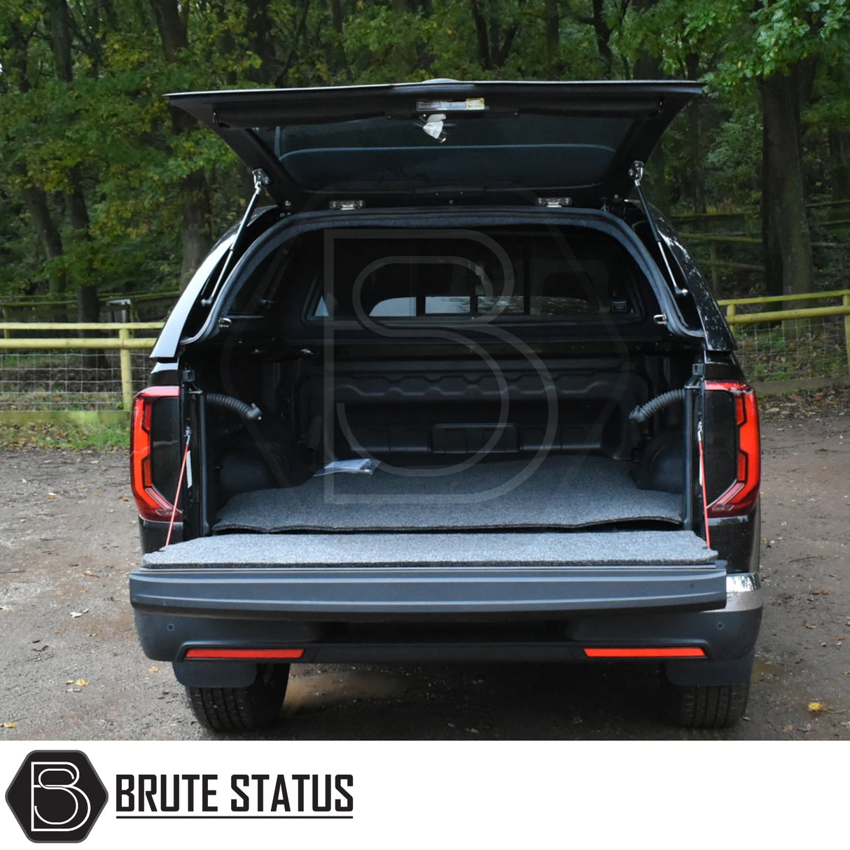 Volkswagen Amarok 2023+ Truckman Grand Hardtop Canopy with open tailgate, featuring a Brute Status storage system and stylish, secure canopy design with remote locking.