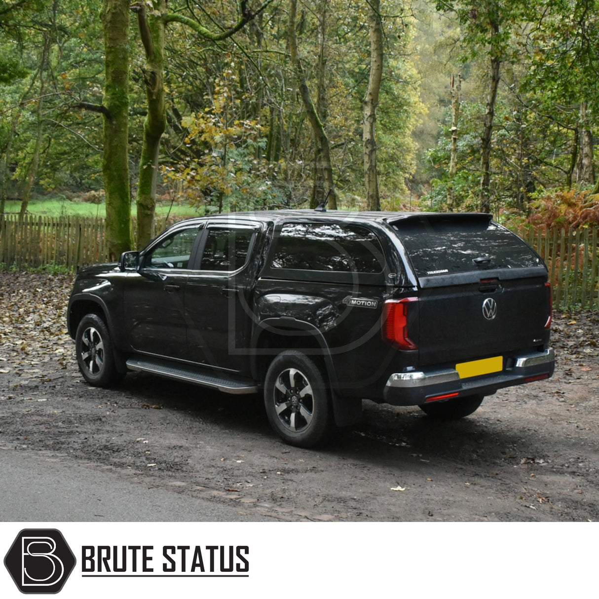 Volkswagen Amarok 2023+ Truckman Grand Hardtop Canopy with remote locking, showcased in a woodland setting, highlighting its stylish design and premium features.