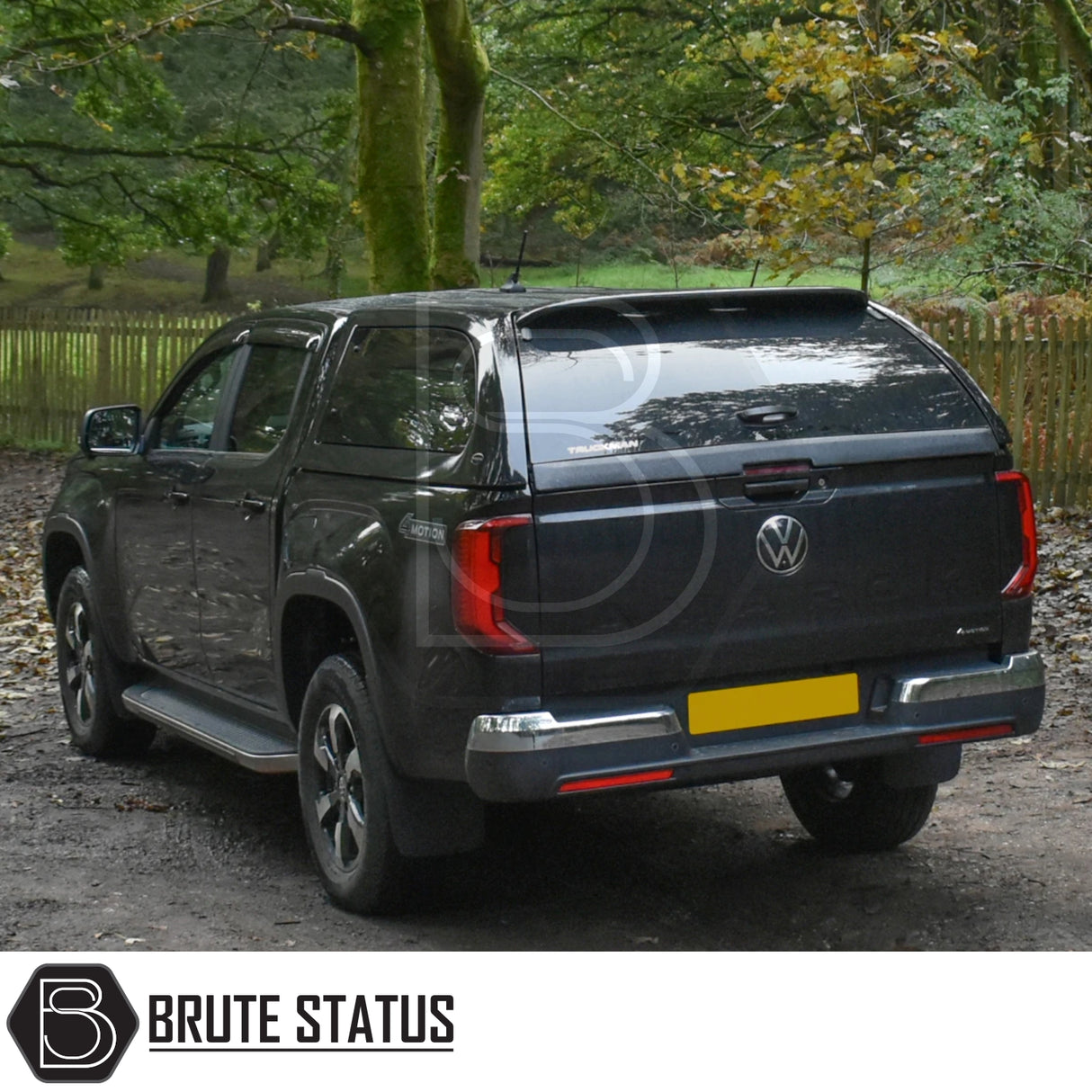 Volkswagen Amarok 2023+ with Truckman Grand Hardtop Canopy featuring remote locking, parked on a forest track, highlighting its premium design and enhanced storage capability.