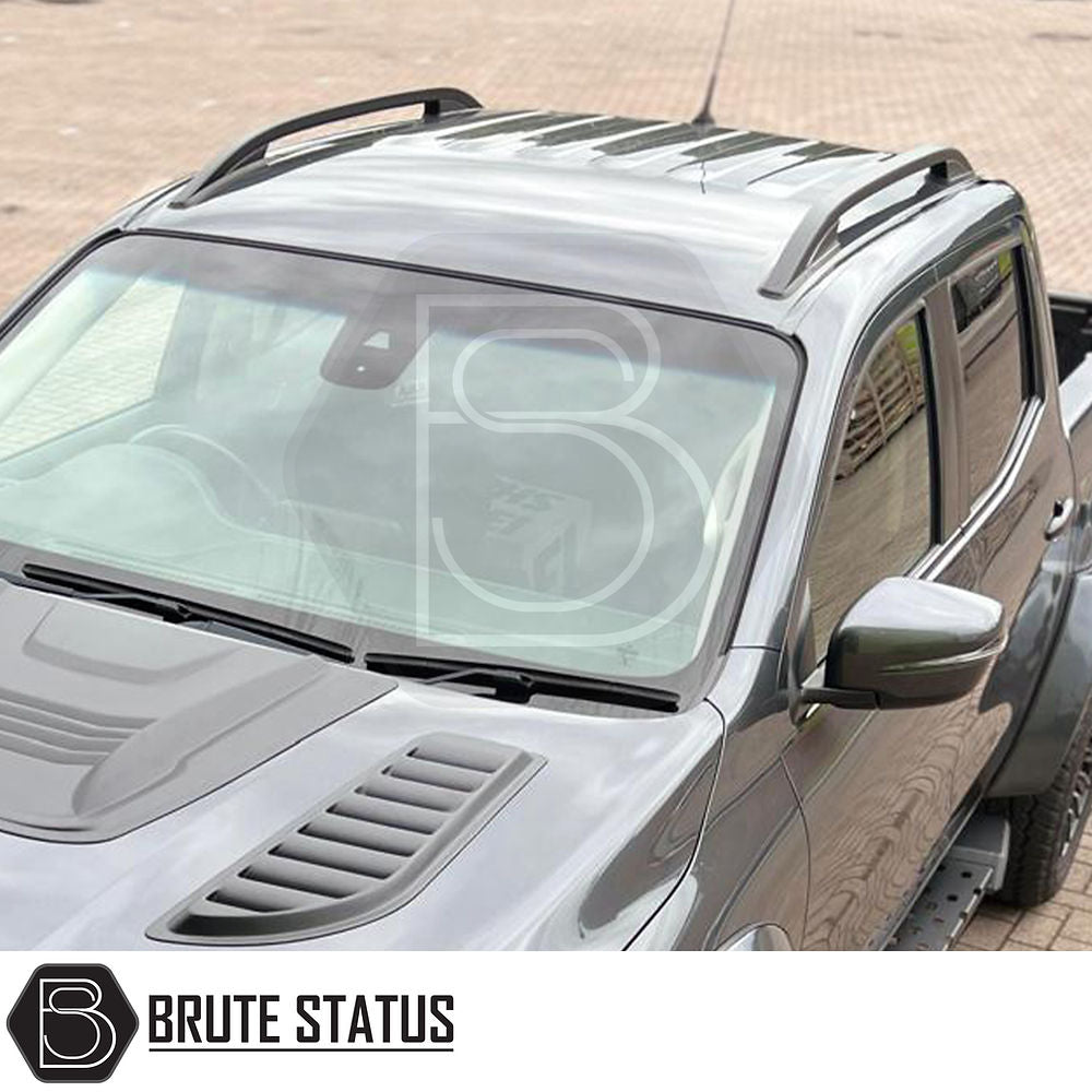 Nissan Navara NP300 2015-2022 Black Roof Rail Kit, shown on a vehicle, enhances utility and style. Ideal for trucks without existing roof bars.
