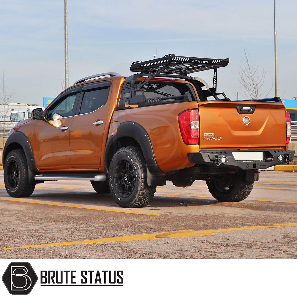 Mitsubishi L200 Series 6 Combat Roll Bar with Storage Basket, designed for off-road utility, shown on a modified orange Nissan Navara with Brute Status accessories.