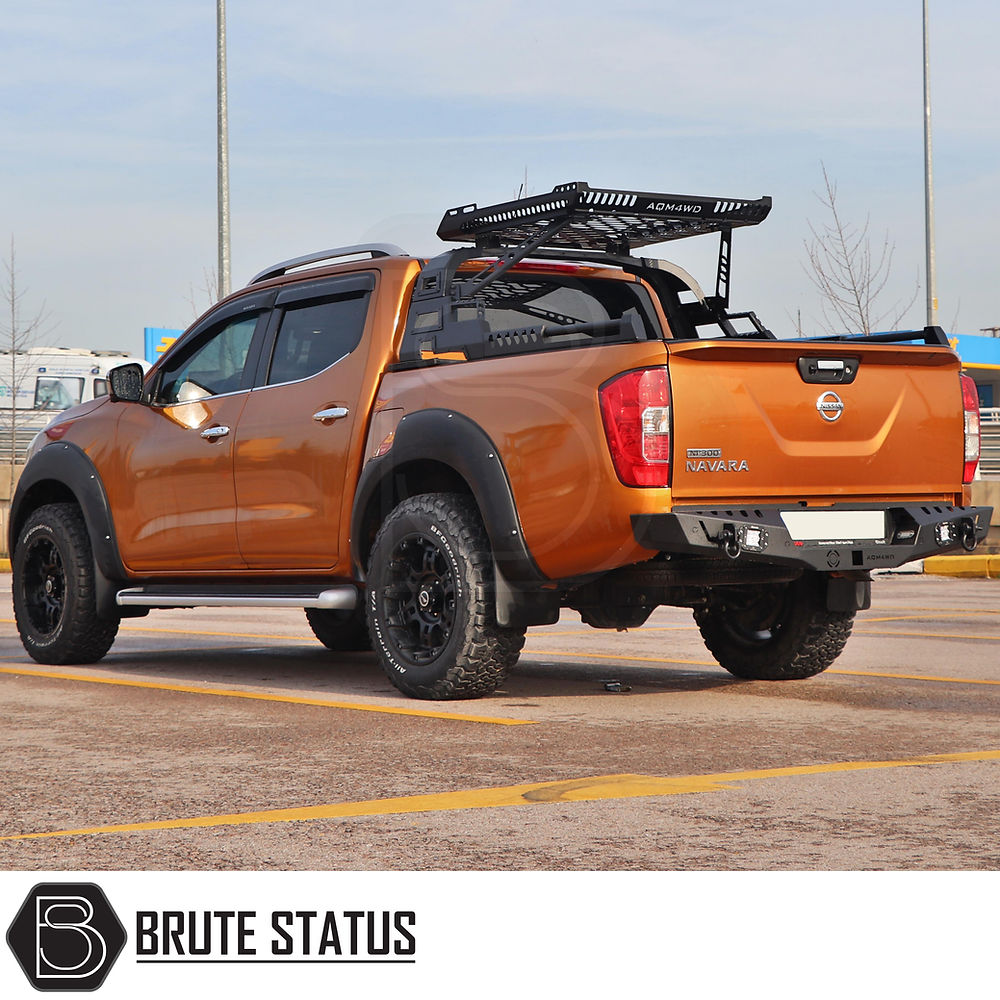 Mercedes X-Class 2017-2020 S10 Combat Roll Bar with Storage Basket on a modified Nissan Navara, featuring off-road accessories like a roof-rack and tubular roll-bar.