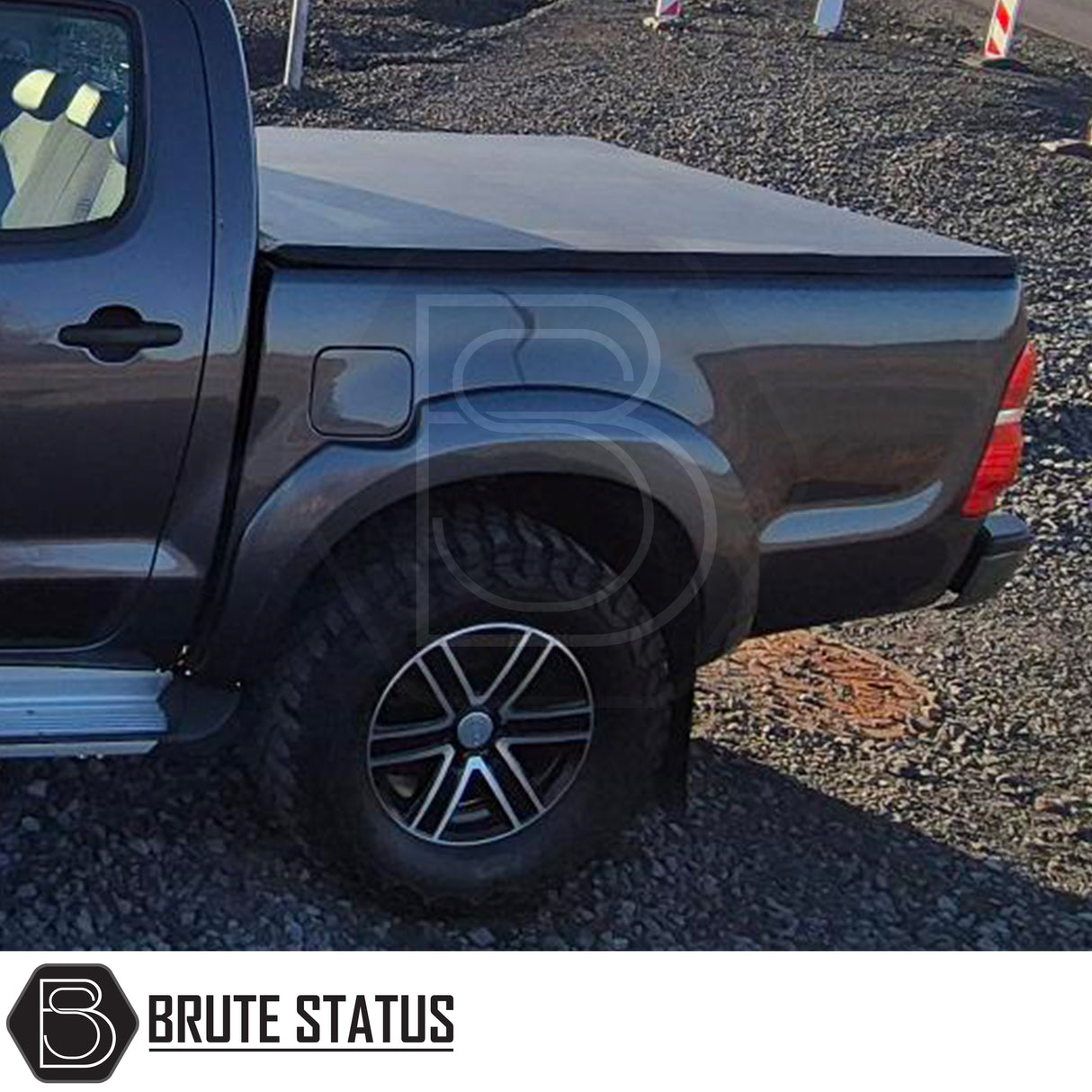 Nissan Navara D40 2005-2015 Tonneau Cover with tri-fold design, open lid, and durable UV stable vinyl for enhanced truck bed protection and aerodynamics.