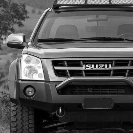 Black and white image of a Isuzu D-max with aftermarket accessories, highlighting its rugged design and customization options offered by Brute Status.